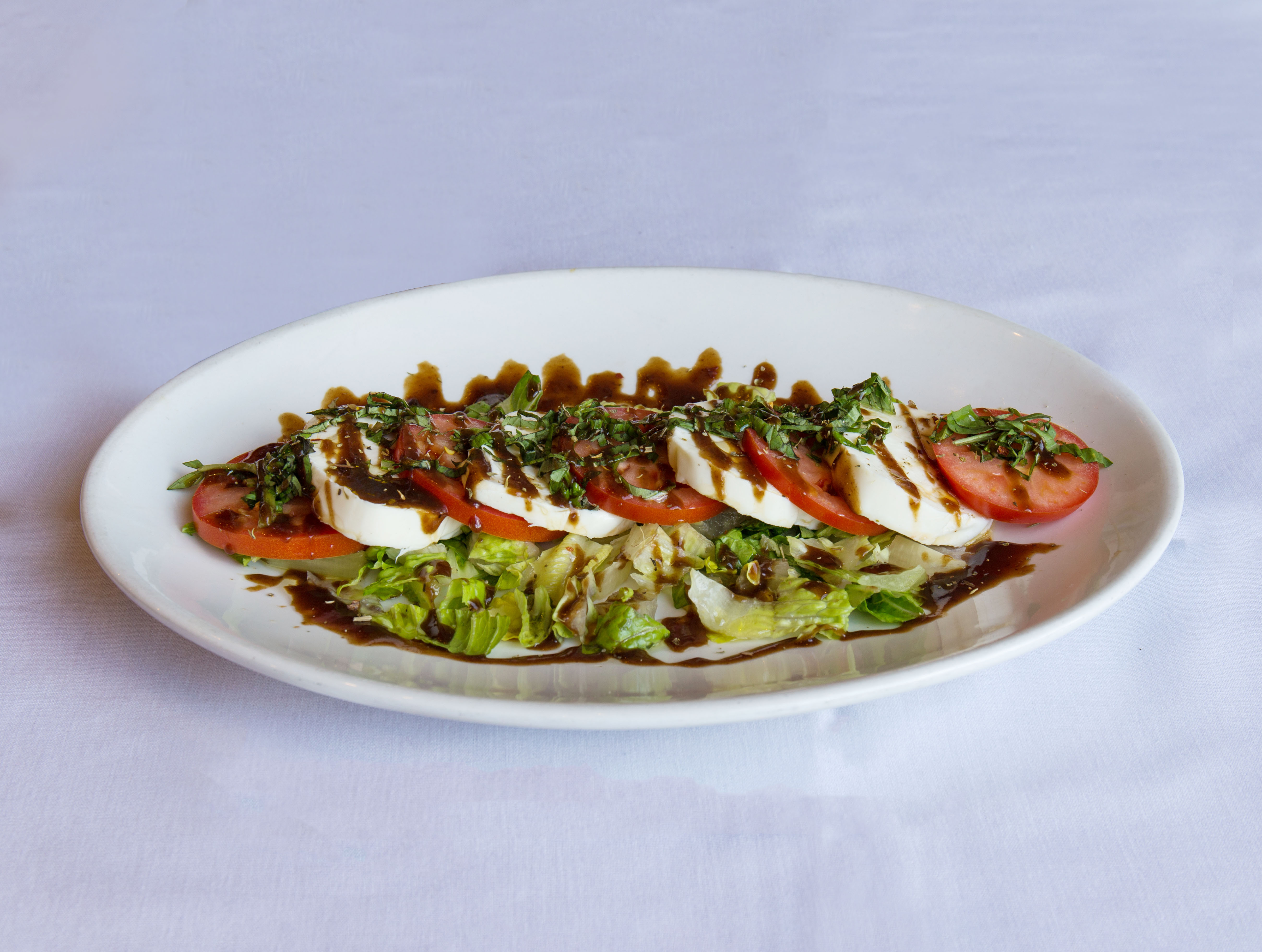 Order Caprese Salad food online from Milano Italian Grill store, San Antonio on bringmethat.com