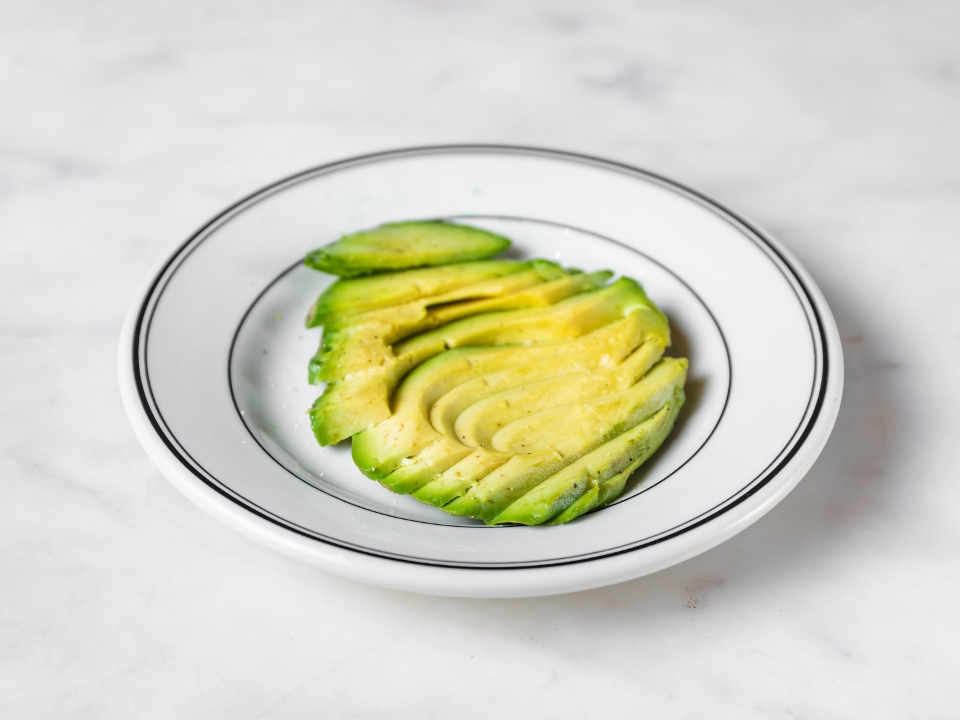 Order Side Sliced Avocado (quarter) food online from Goddess and the Baker store, Chicago on bringmethat.com