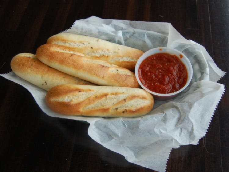 Order Bread Sticks - 4 Pieces food online from Claymont Steak Shop store, Claymont on bringmethat.com