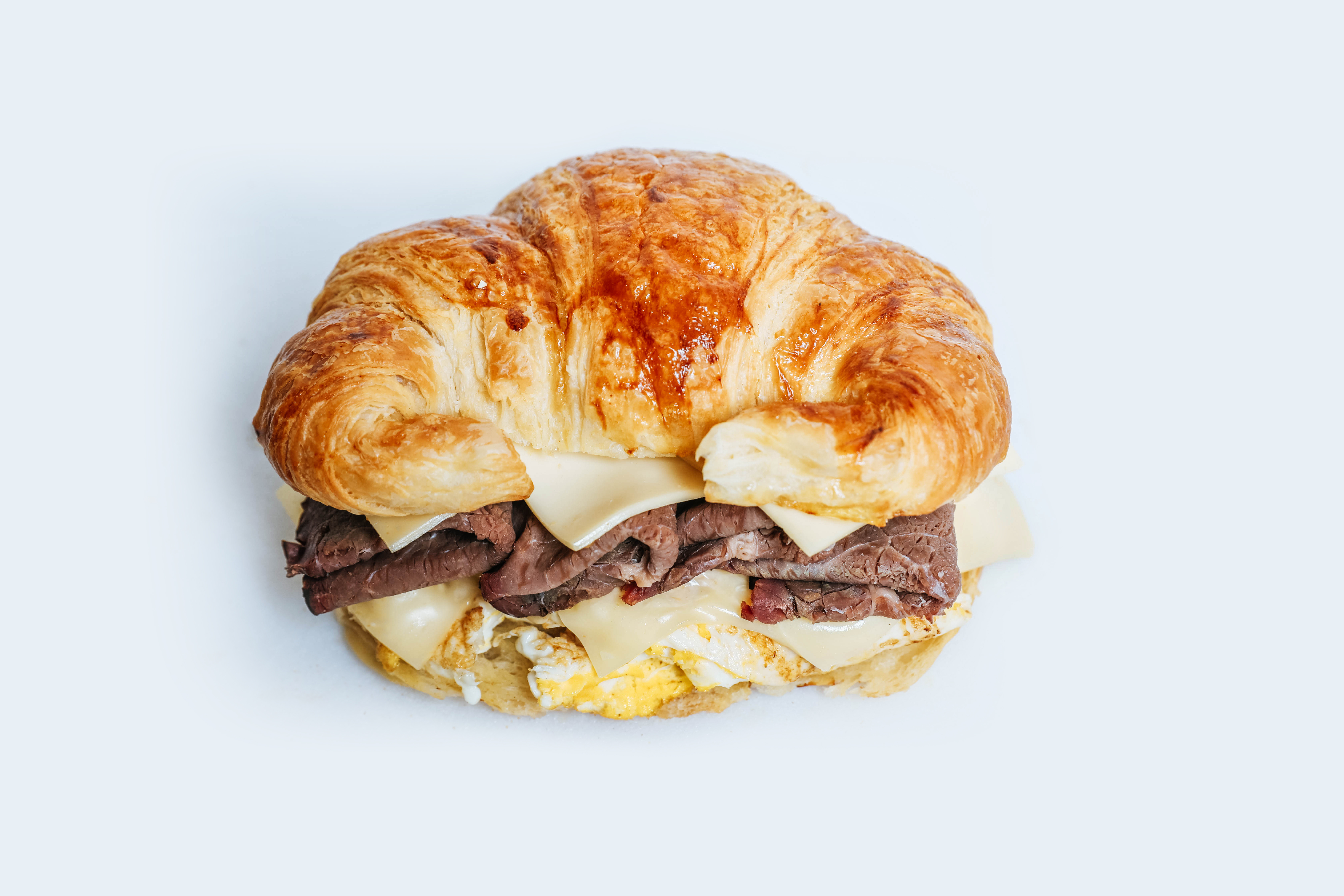 Order #15 Roast Beef Croissant food online from Dc Donut Cafe store, Granada Hills on bringmethat.com