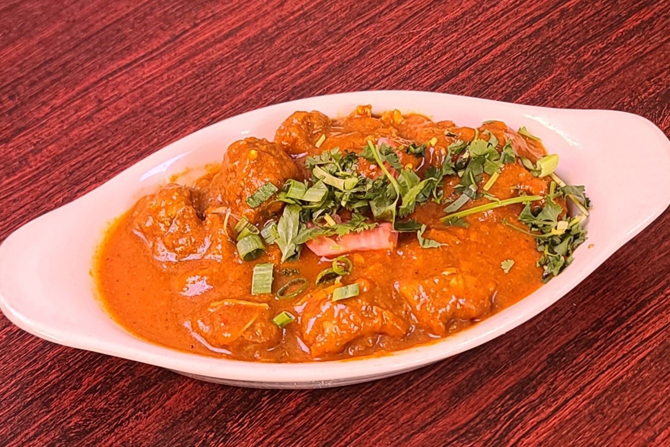 Order Lamb Curry food online from Om Indian Cuisine store, San Francisco on bringmethat.com