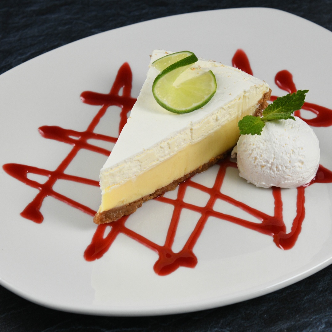 Order Key Lime Pie food online from Rainforest Cafe store, Las Vegas on bringmethat.com