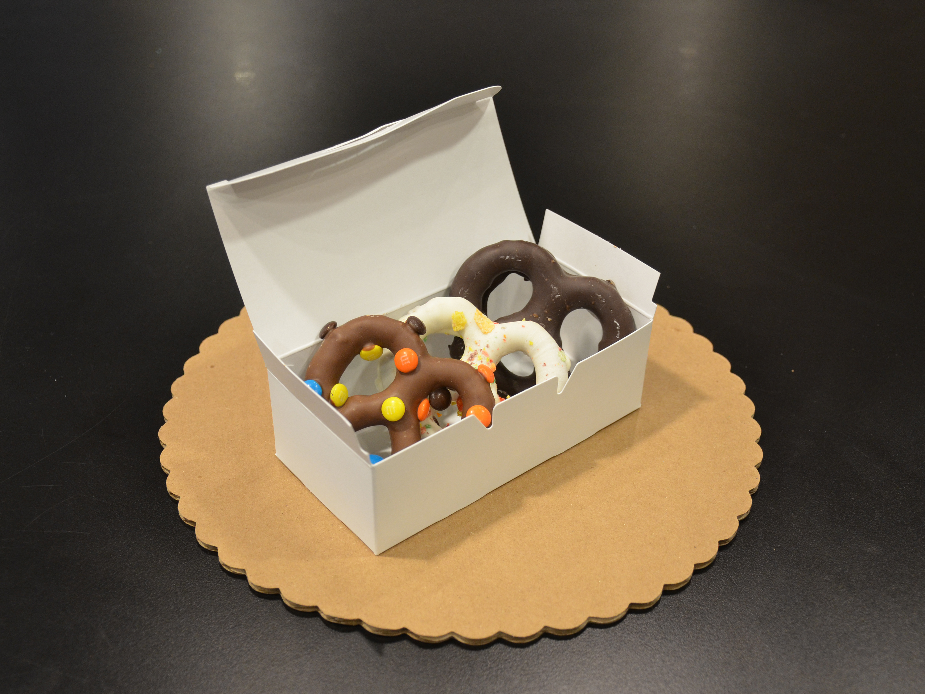 Order 6 chocolate covered pretzels food online from Schakolad Chocolate Factory store, Plainfield on bringmethat.com