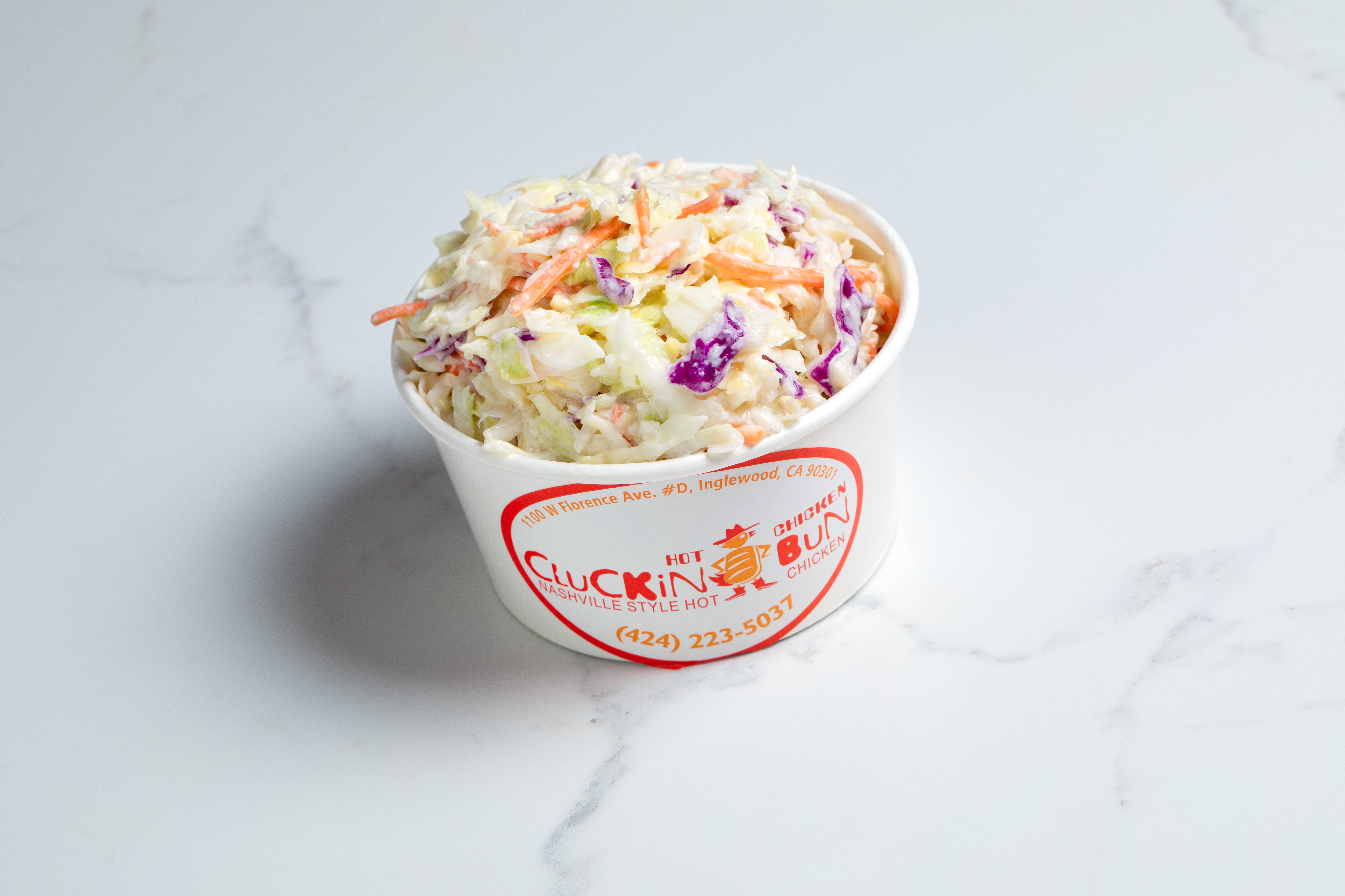 Order Coleslaw food online from Cluckin Bun store, cathedral city on bringmethat.com