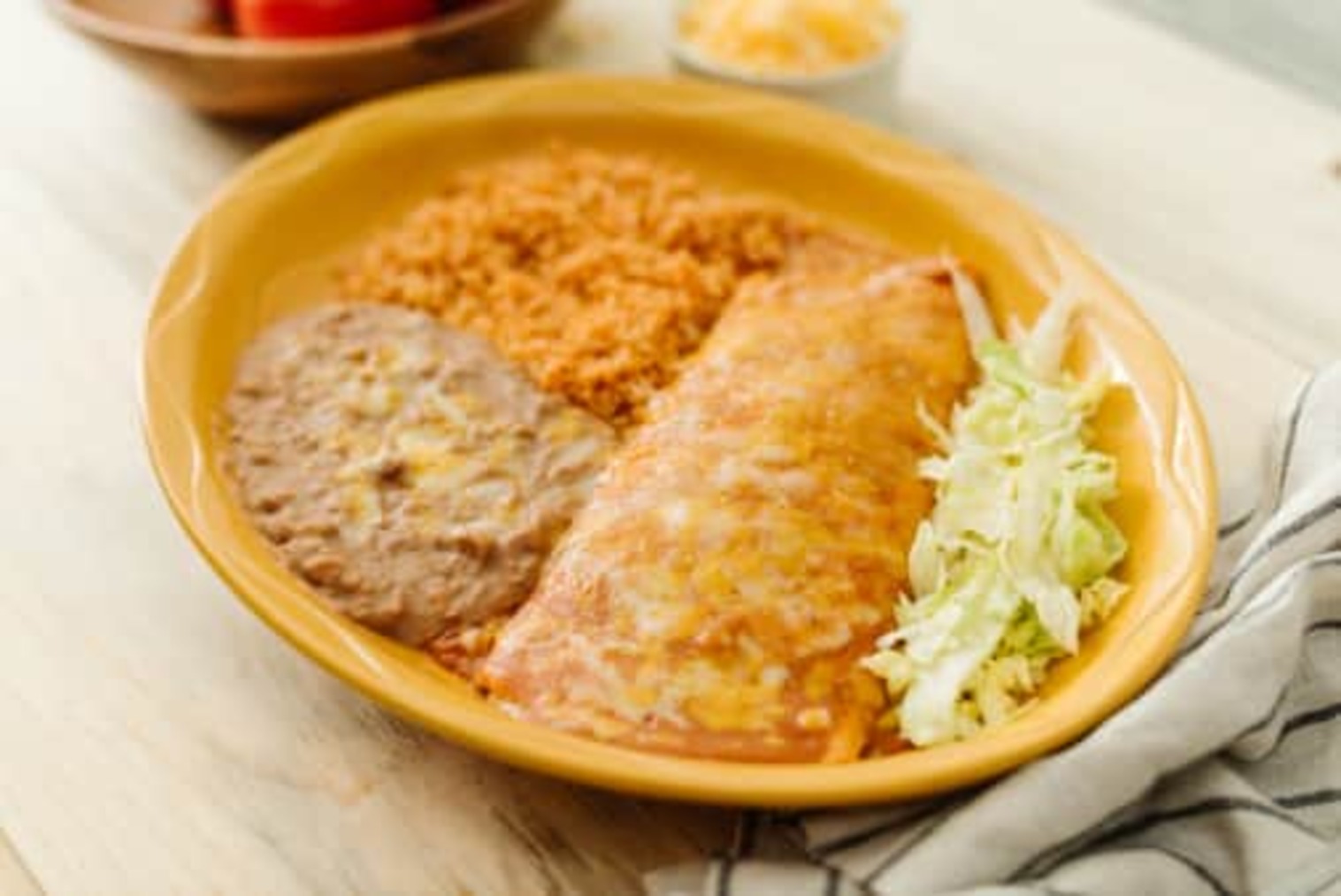 Order #12 Bean Burrito Enchilada Style food online from Su Casa Mexican Restaurant store, Midvale on bringmethat.com