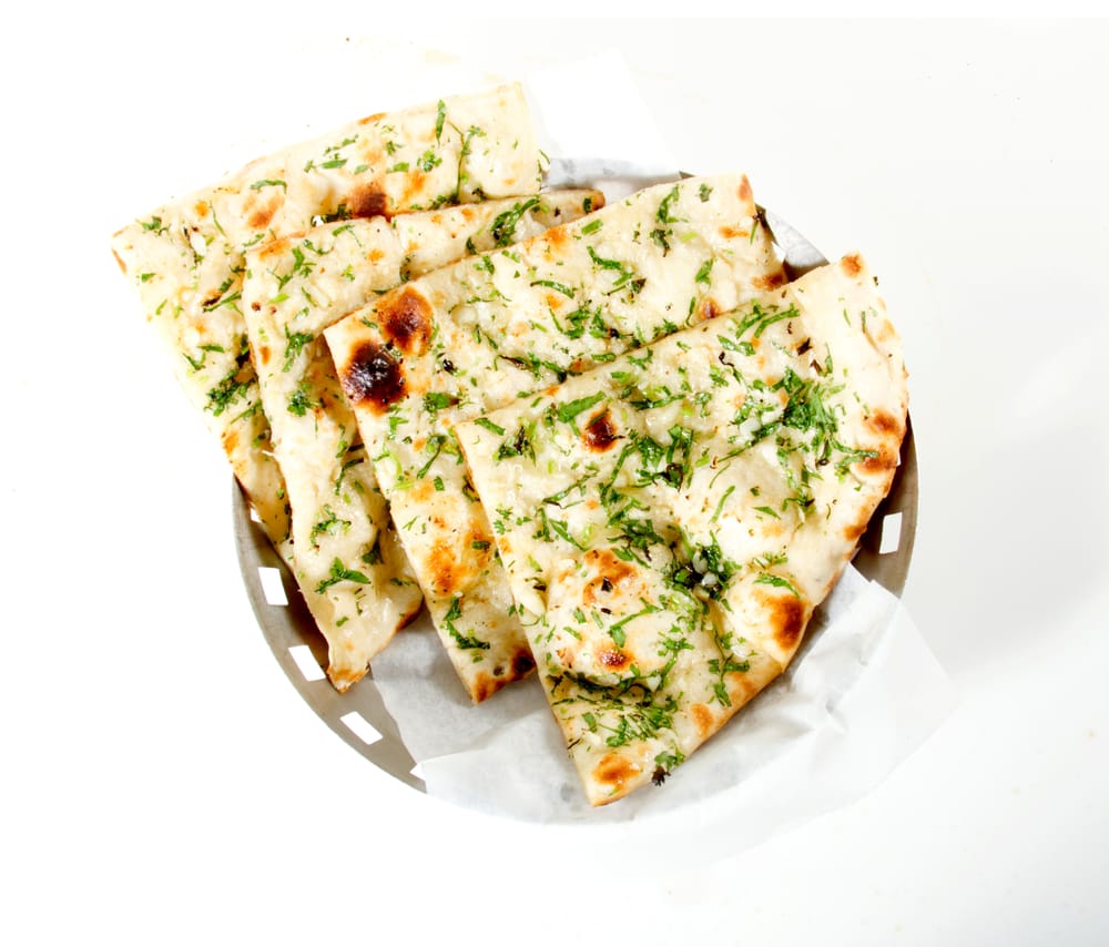 Order Garlic Basil Naan food online from Sizzling bombay store, Bel Air on bringmethat.com