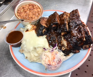 Order Smoked BBQ Baby Back Ribs food online from Cowgirl store, New York on bringmethat.com