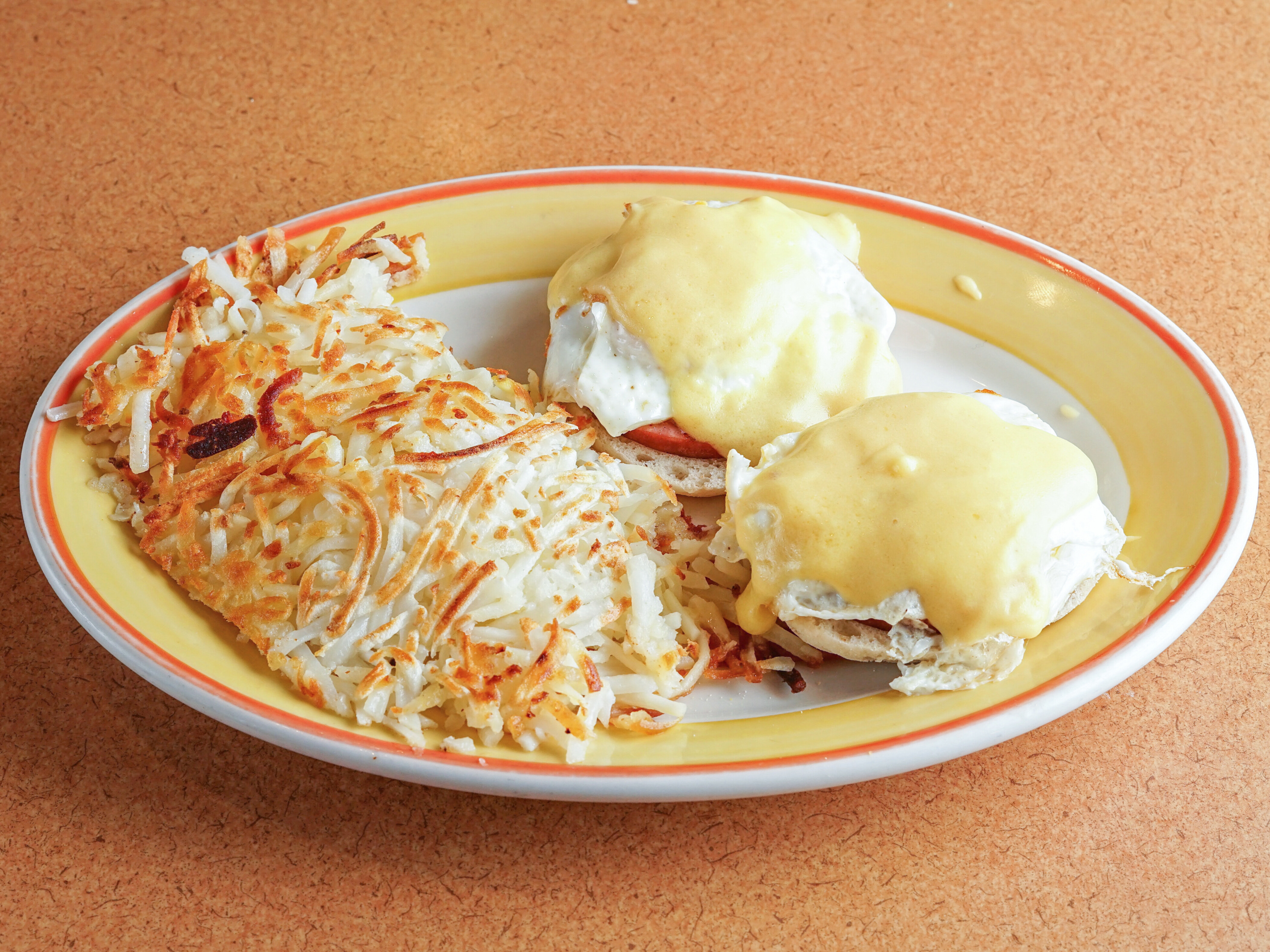 Order 1. Eggs Benedict with Potatoes food online from Temple Family Restaurant store, Temple on bringmethat.com