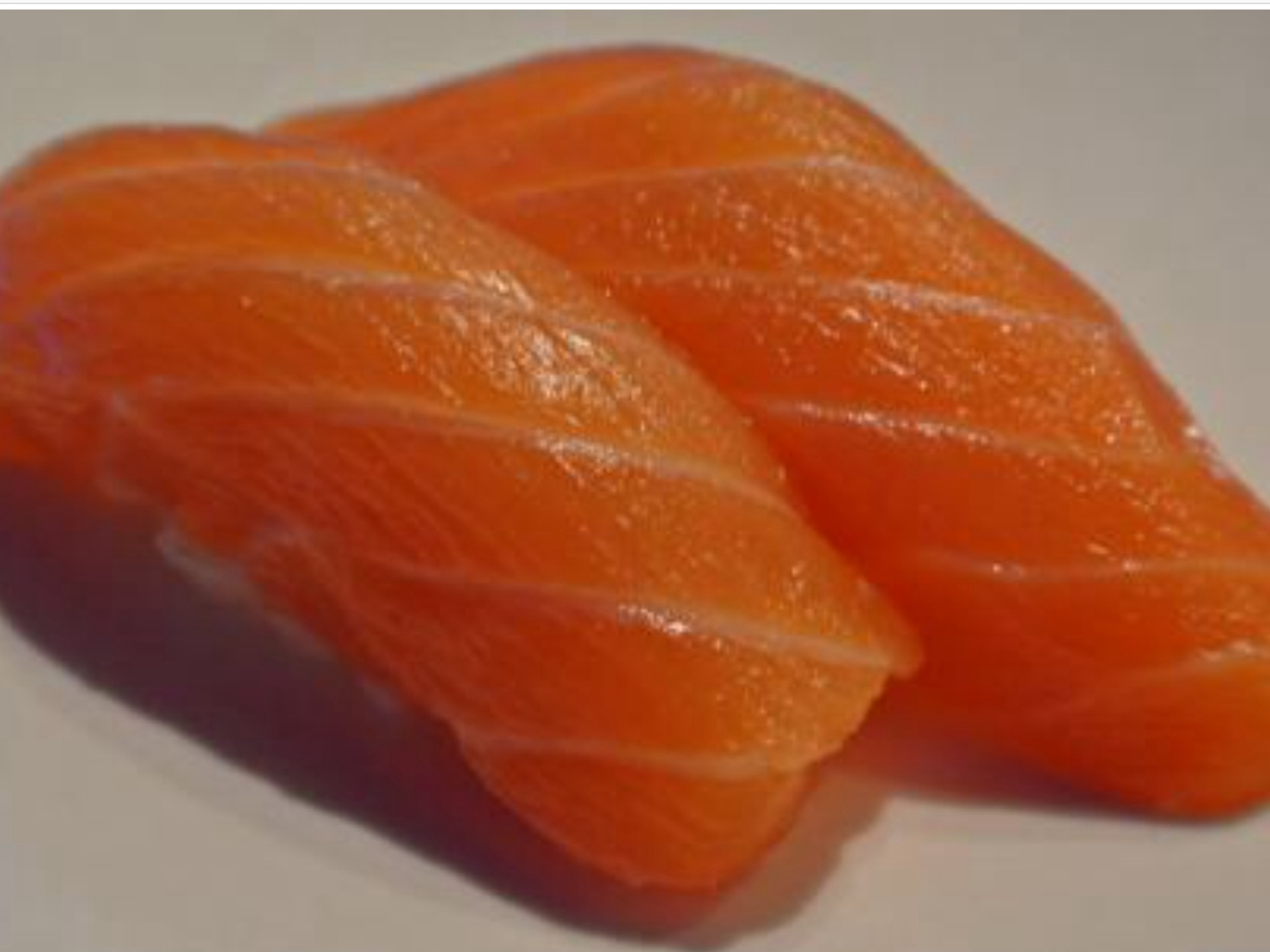 Order Salmon Sushi /Sake (2pcs) food online from Roll Star Sushi store, Anaheim on bringmethat.com
