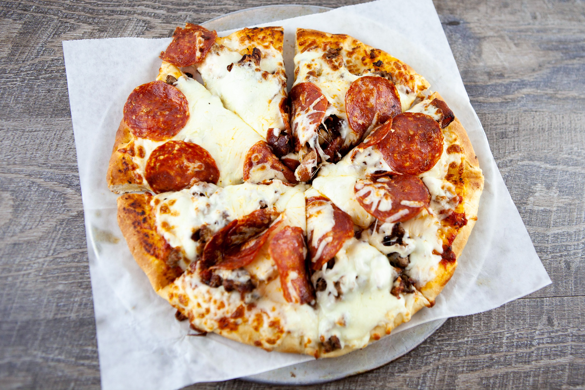 Order Three Meat Pizza food online from Fitz's store, University City on bringmethat.com