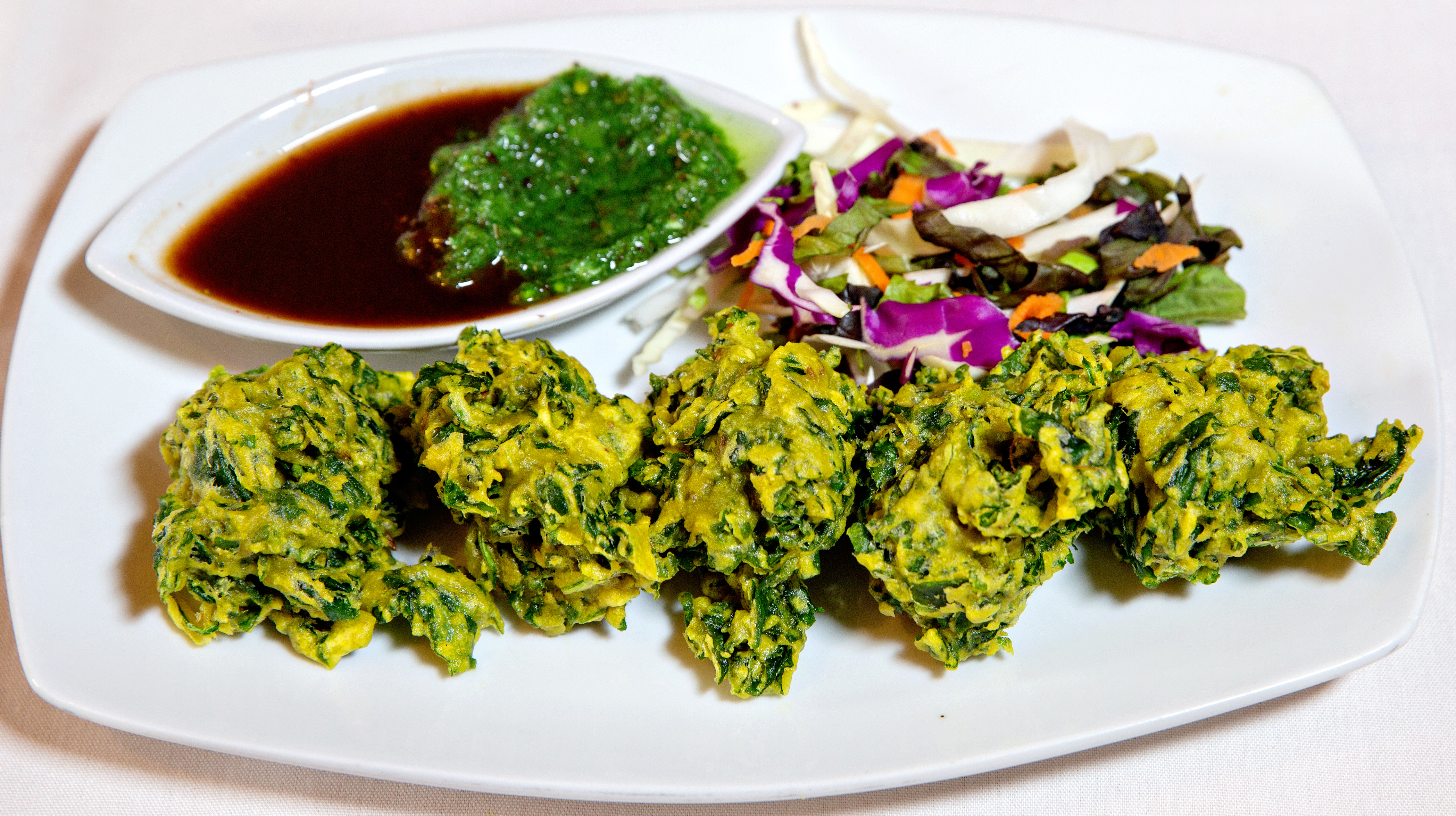 Order Spinach Pakora (GV/V) food online from Rajput Indian Cuisine store, Suffolk on bringmethat.com