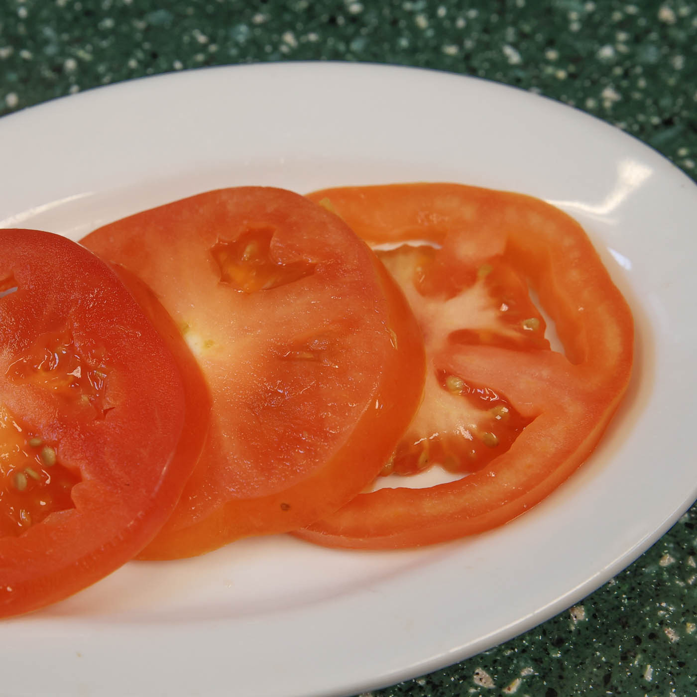 Order Sliced Tomato food online from Sunny Street Cafe store, Painesville on bringmethat.com