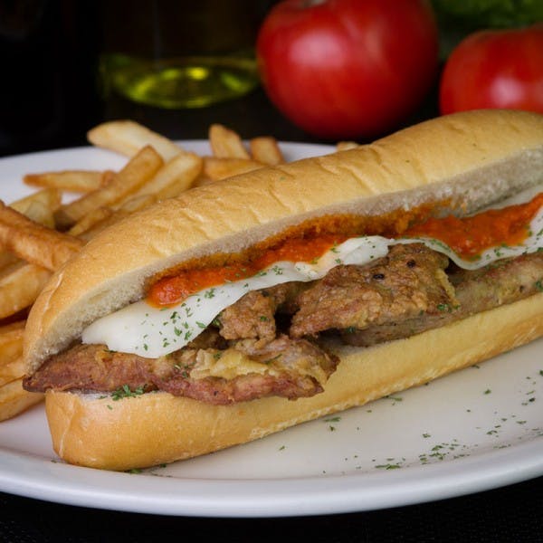 Order Veal Parm Sub - Medium food online from Golden Pizzeria store, Norfolk on bringmethat.com