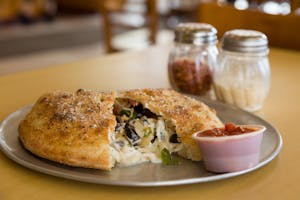 Order Spinach Calzone food online from Massino's Pizzeria store, Aurora on bringmethat.com