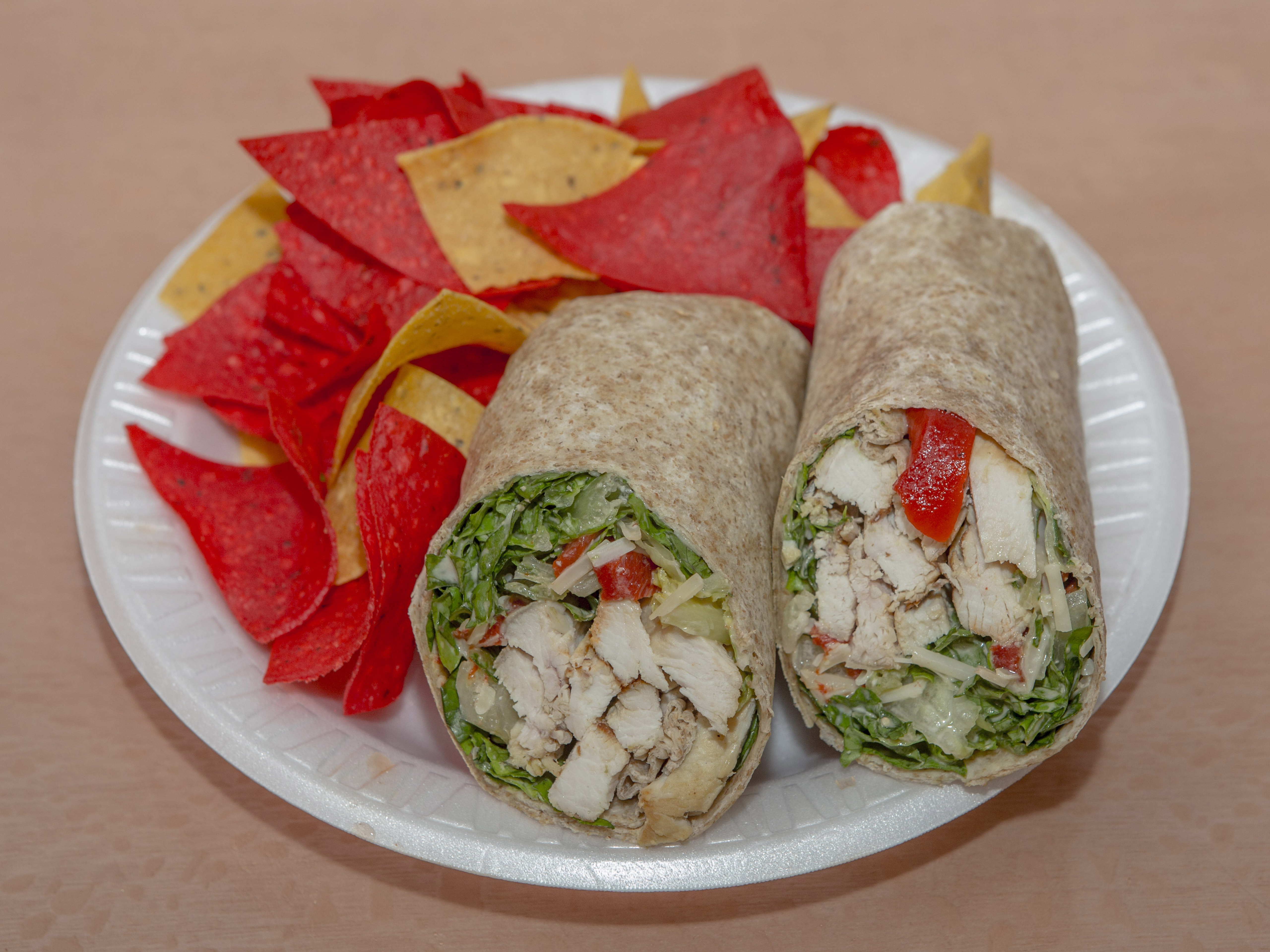 Order Chicken Caesar Wrap food online from Panini Grill store, New York on bringmethat.com