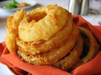 Order 12 Onion Rings food online from Mackie Steakhouse store, Oklahoma City on bringmethat.com