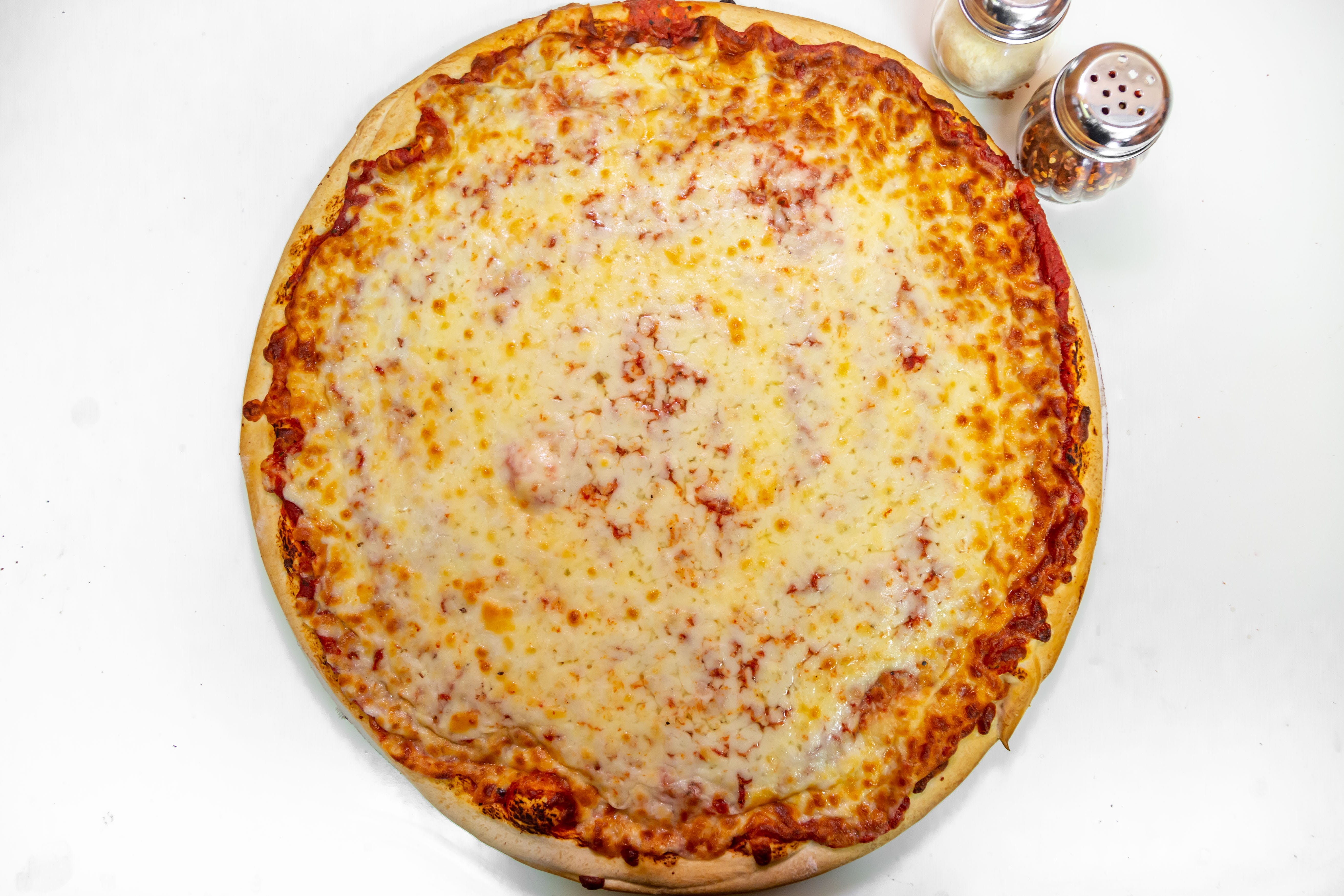 Order Slice of Cheese Pizza - Slice food online from Benny's Pizza store, Chicago on bringmethat.com