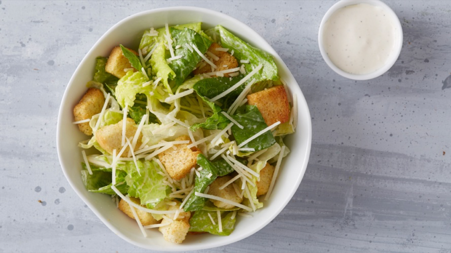 Order Caesar Salad (Tray) food online from Wings Over Milwaukee store, Milwaukee on bringmethat.com