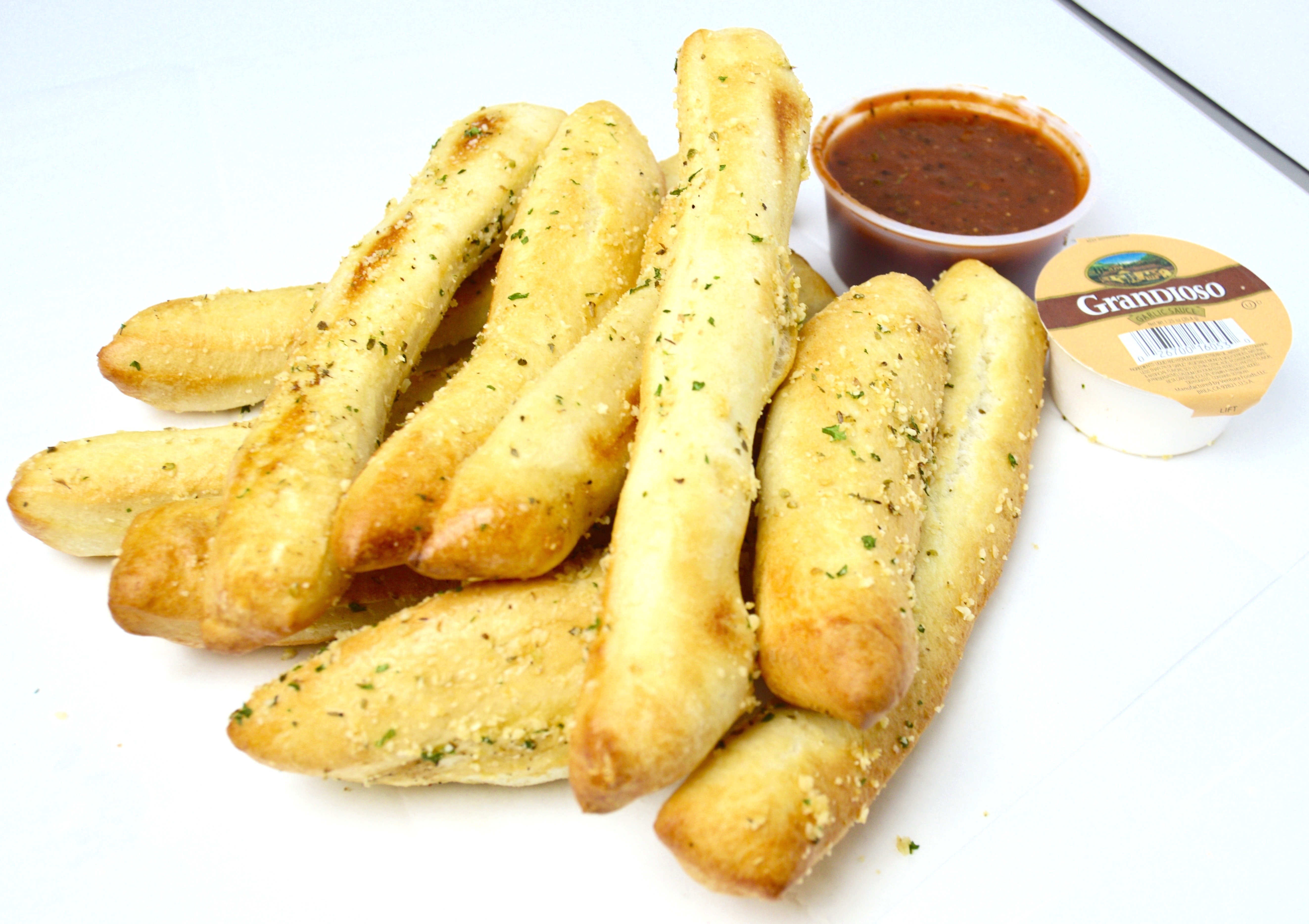 Order Garlic Parm Stix food online from D.P. Dough store, Fort Collins on bringmethat.com