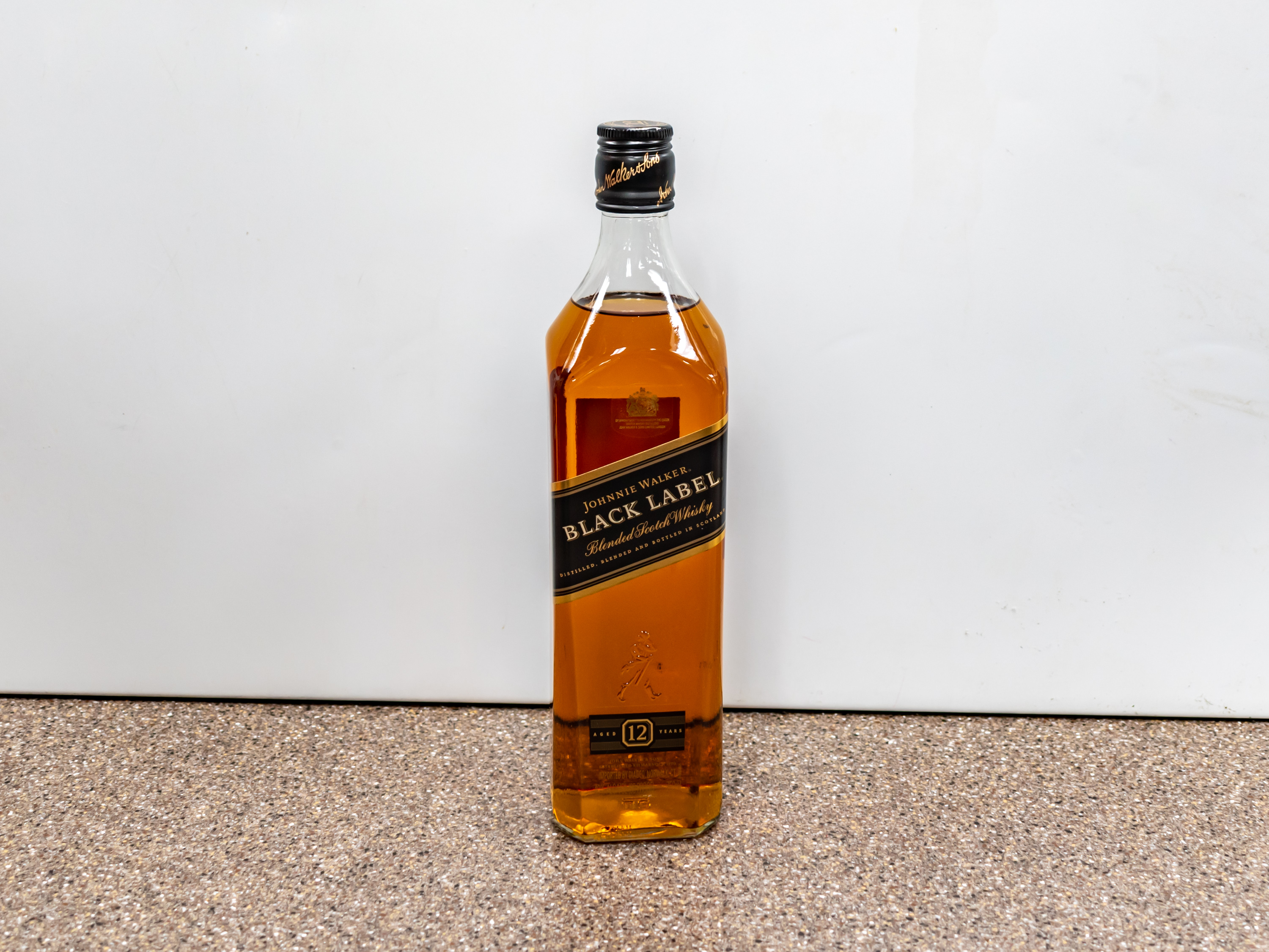 Order Johnnie Walker Black Label Blended Scotch Whisky 750 ml food online from Kangaroo Food Mart store, Cathedral City on bringmethat.com