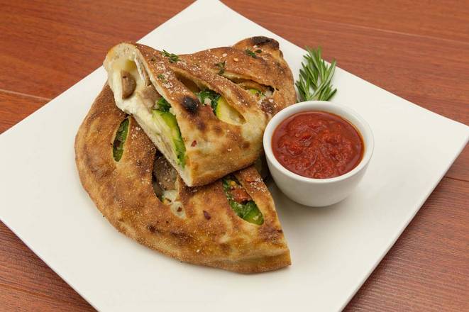 Order Sausage and Peppers Calzone food online from Stone Hot Pizza store, Arlington on bringmethat.com