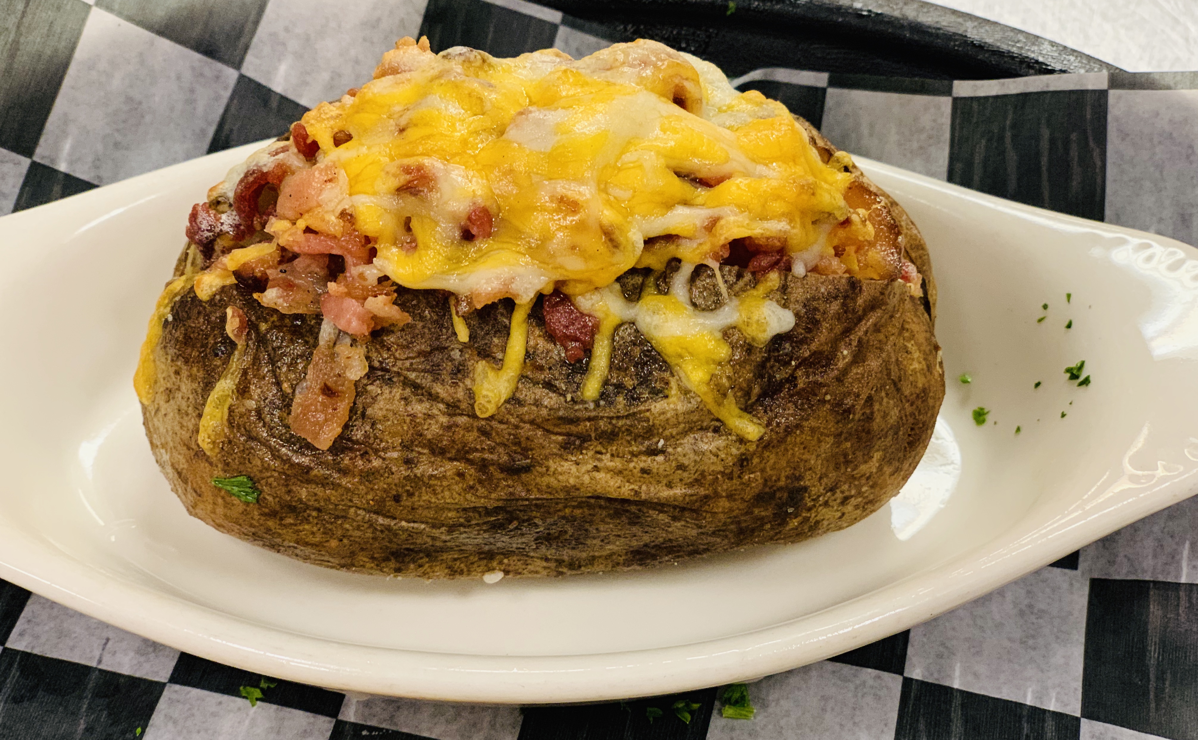 Order Loaded Baked Potato food online from Mojo Pub -N- Grill store, Youngstown on bringmethat.com