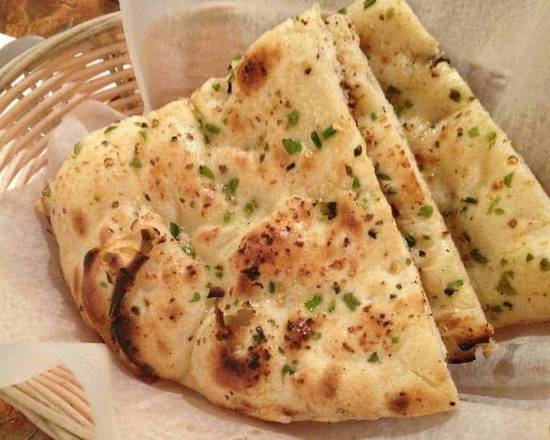 Order Garlic Naan food online from Taste Of India store, Albuquerque on bringmethat.com