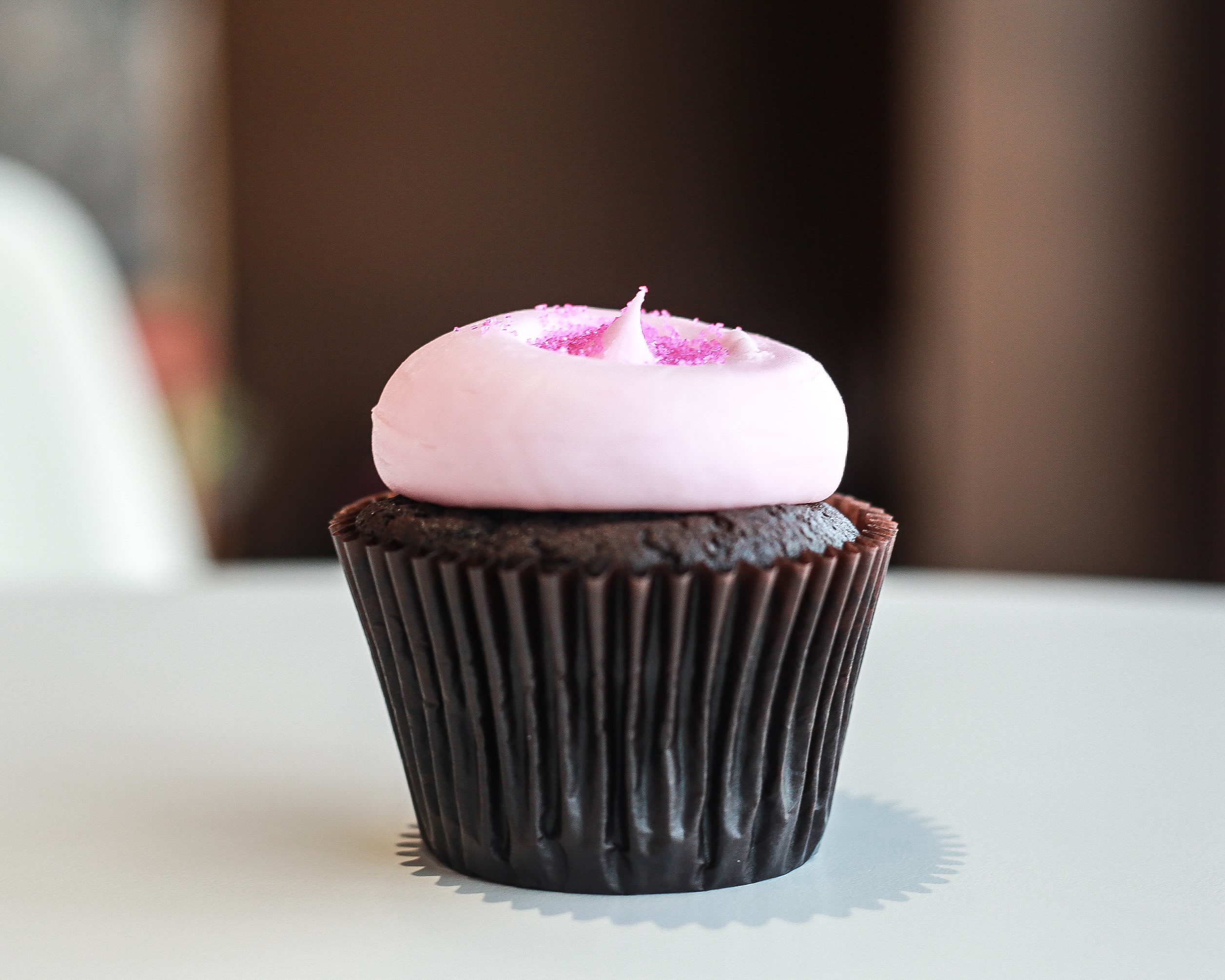 Order Pink Chocolate Cupcake food online from Smallcakes store, Huntersville on bringmethat.com