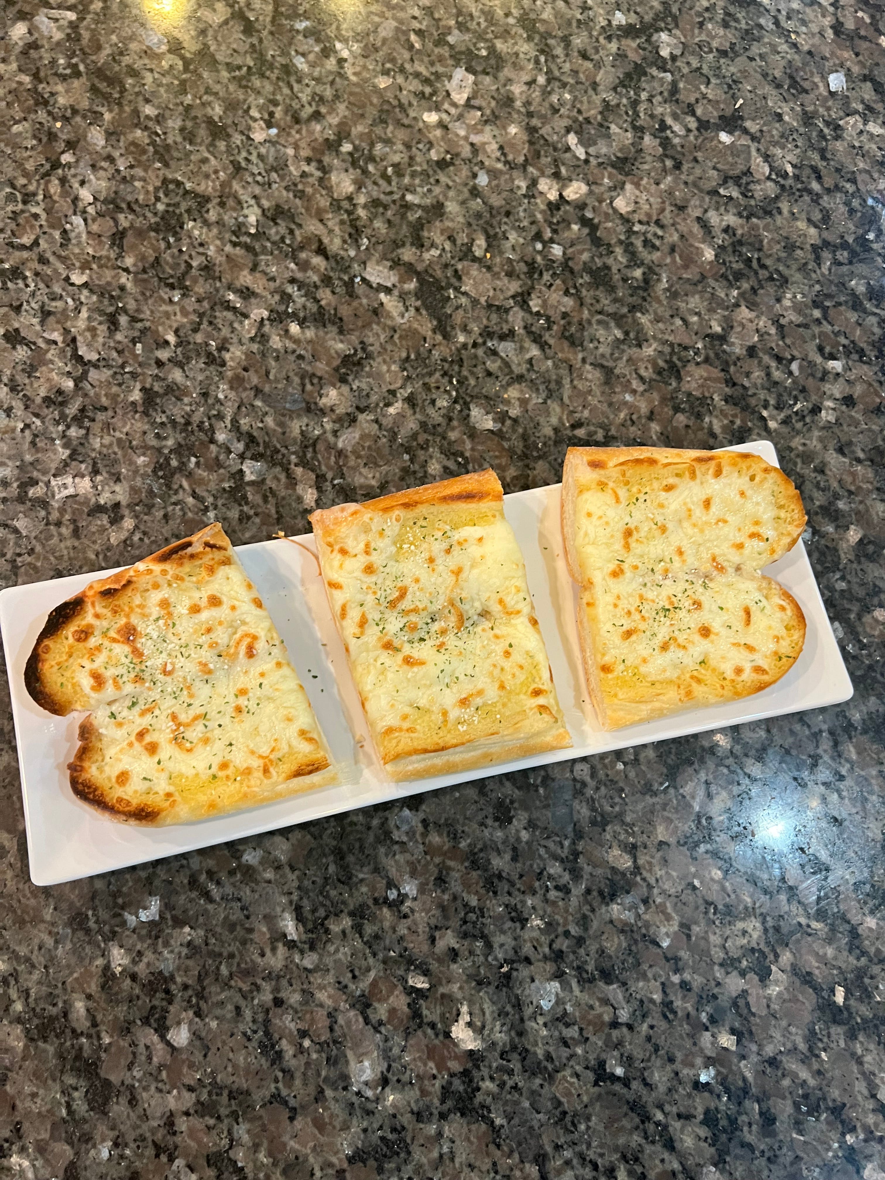 Order Garlic Bread with Cheese - Appetizer food online from Margherita's Restaurant Pizzeria and Bar store, Laureldale on bringmethat.com