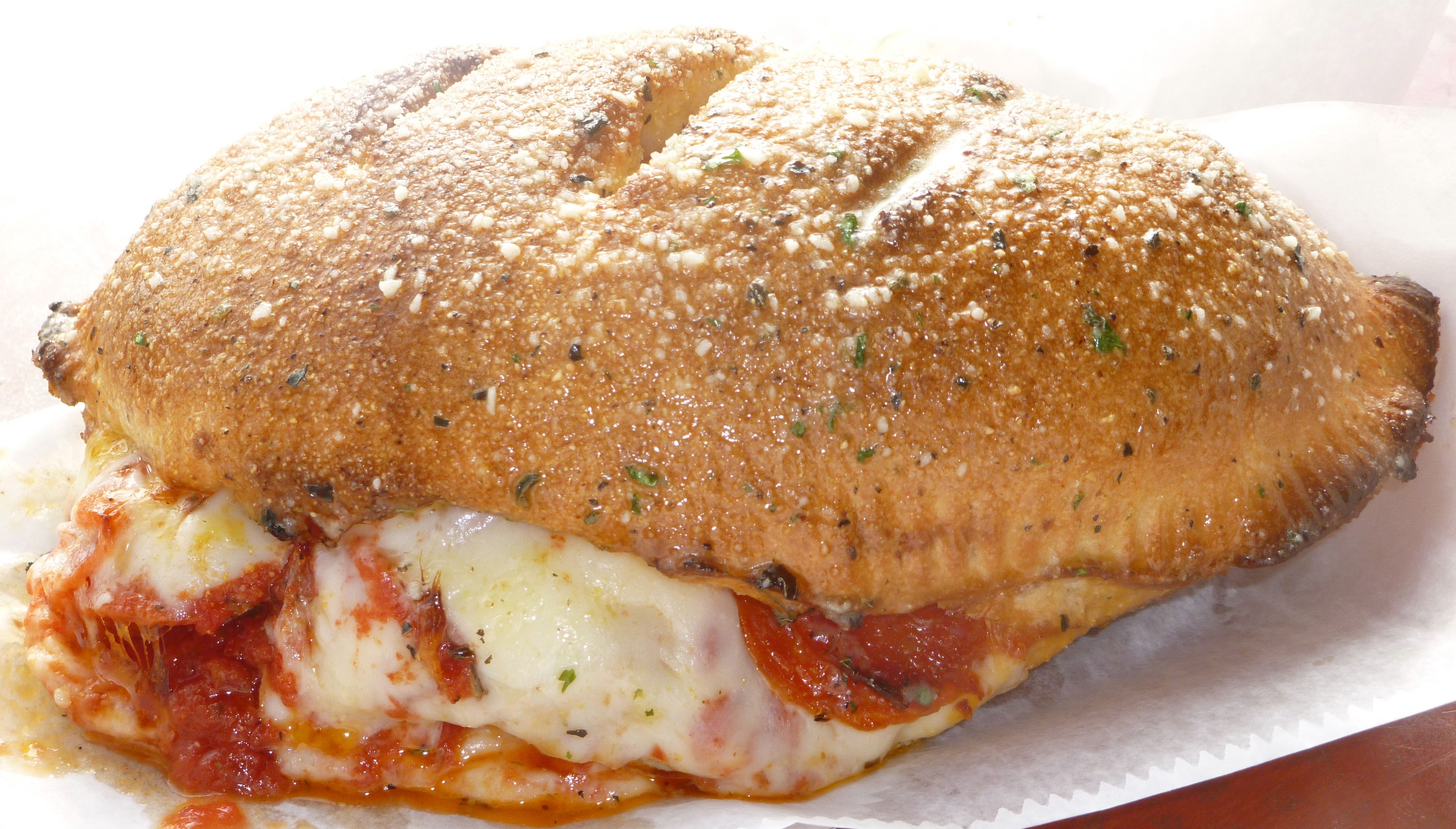 Order Calzone food online from Pizza Shuttle store, Milwaukee on bringmethat.com