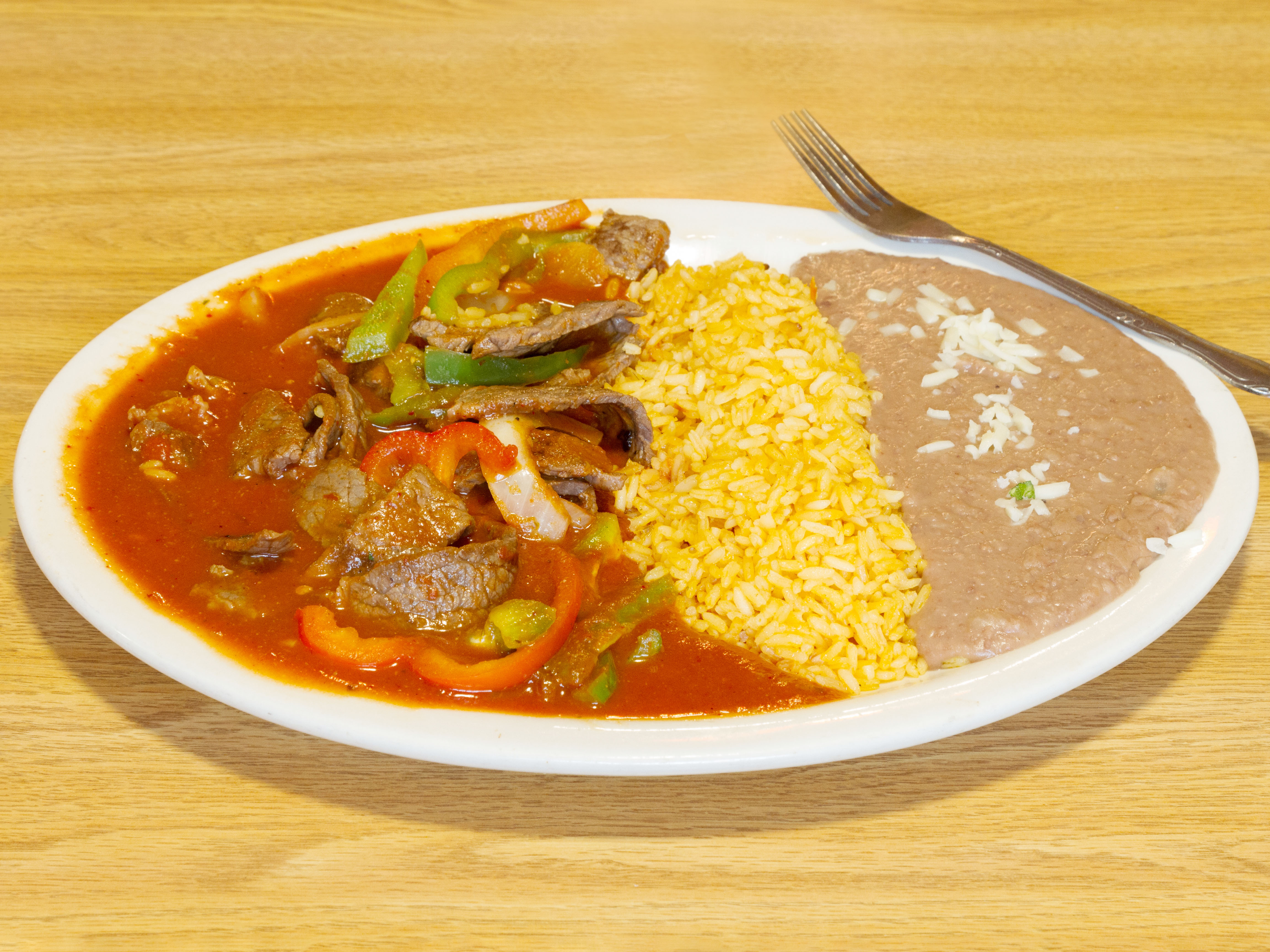 Order Bistec Ranchero food online from Taqueria Mexico store, Waltham on bringmethat.com
