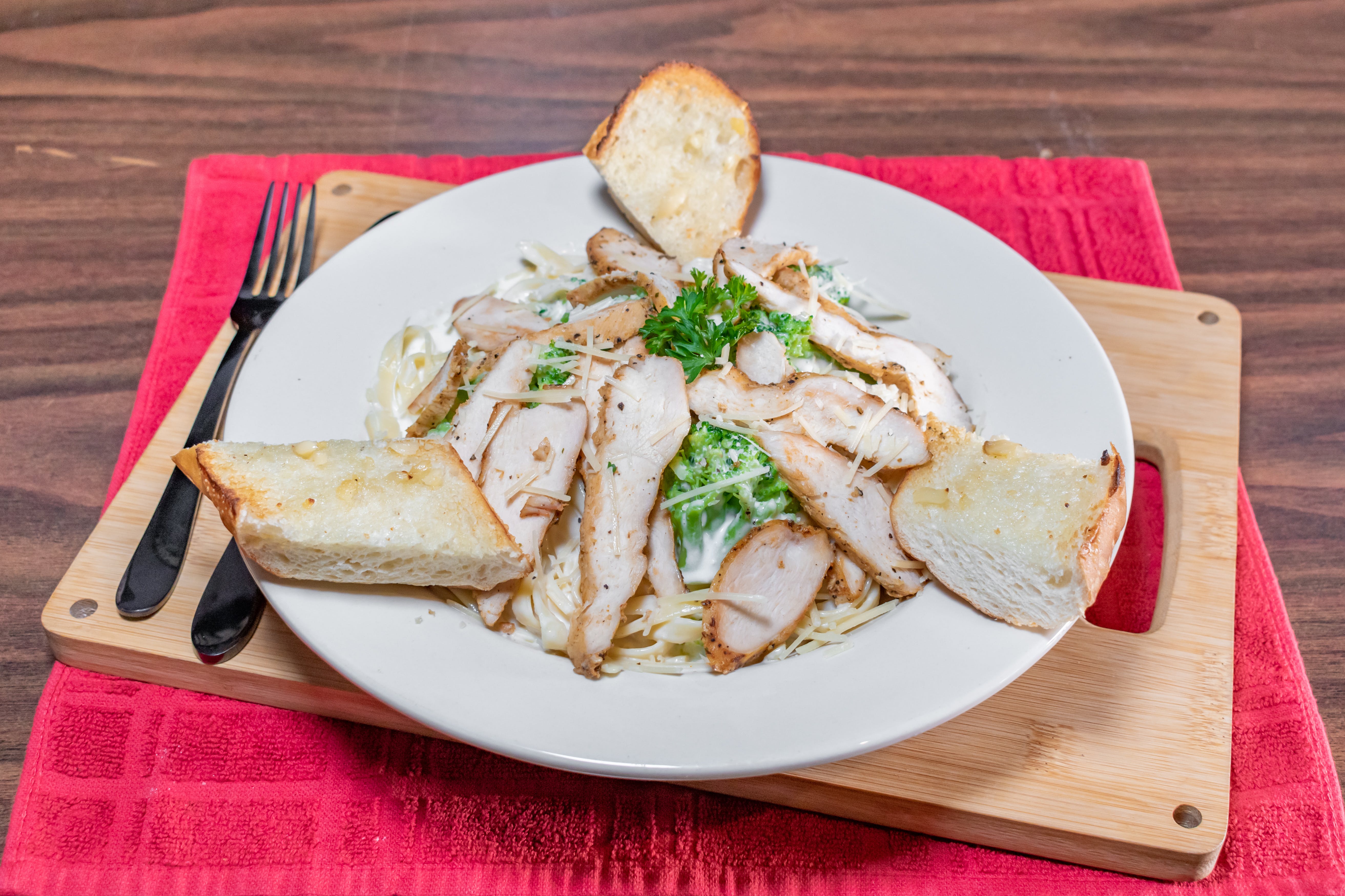 Order Fetttuccini Alfredo with Chicken - Pasta food online from Gotham Pizza store, Houston on bringmethat.com