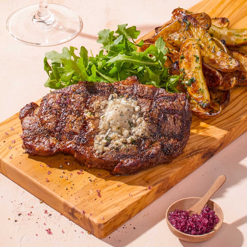 Order FIRE-GRILLED RIBEYE* food online from California Pizza Kitchen store, Honolulu on bringmethat.com