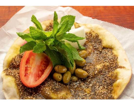 Order Zaatar Extra Pie with Vegetables food online from Karam restaurant catering store, New York on bringmethat.com