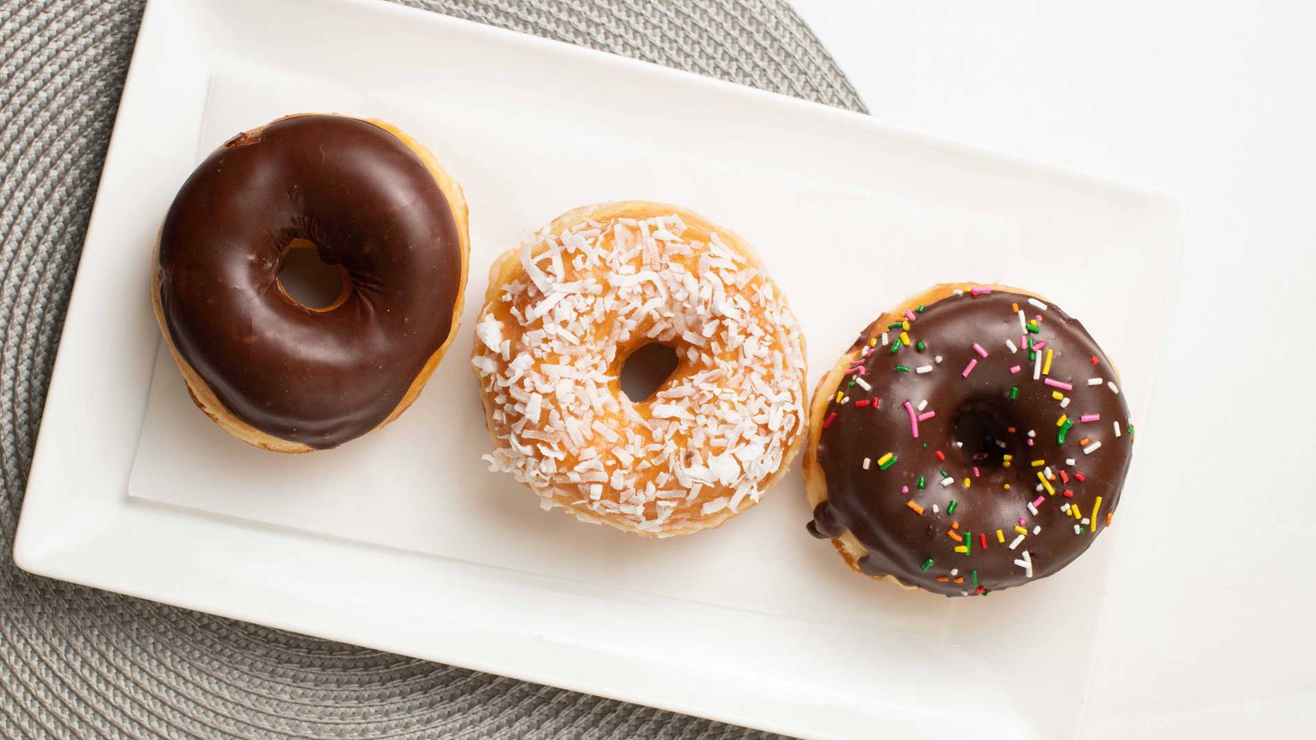 Order Chocolate Ice with Sprinkles Donut food online from country donutz store, Salisbury on bringmethat.com