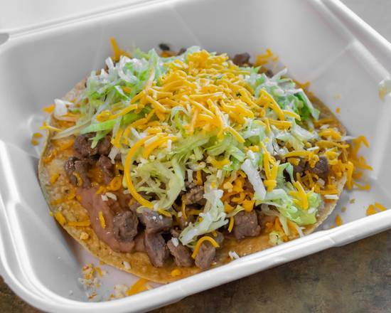 Order Carne Asada Tostada food online from Los Alazanes Mexican Food store, Barstow on bringmethat.com