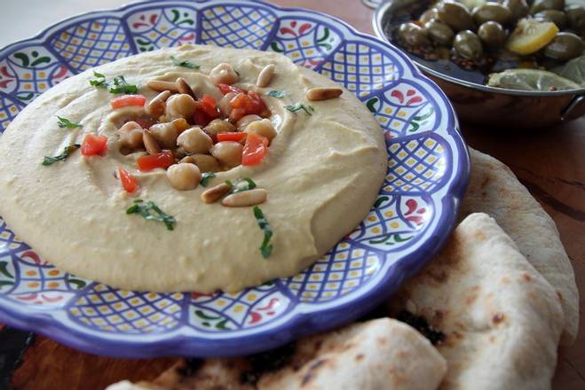 Order Fresh Hummus with Israeli Pita food online from Etai’s Bakery Cafe store, Denver on bringmethat.com