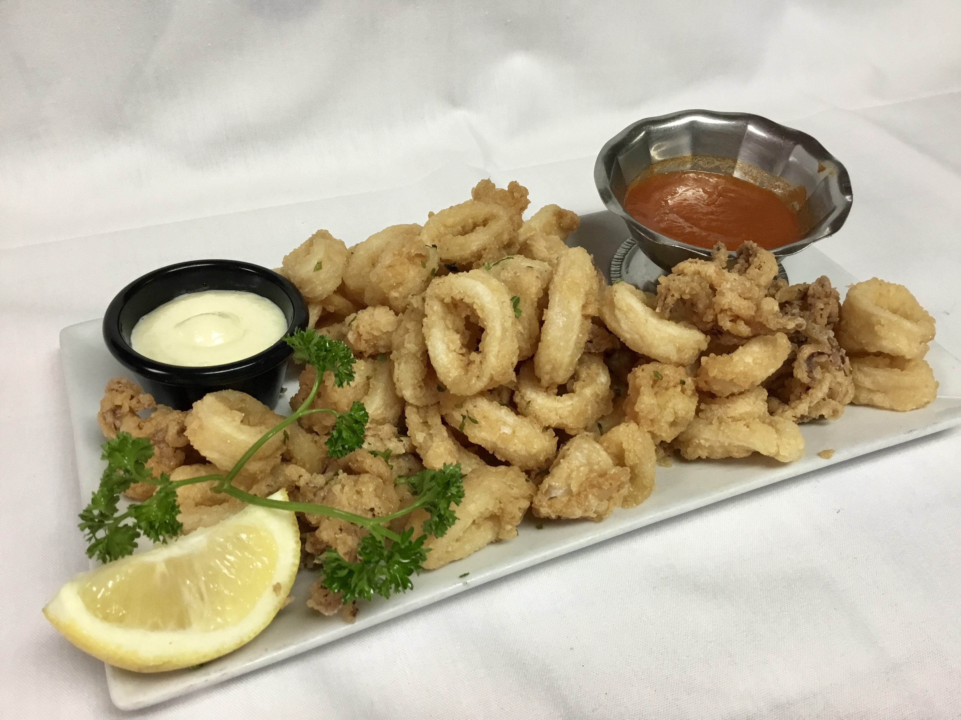 Order Fried Calamari food online from Vivo Tapas Kitchen Lounge store, Newark on bringmethat.com