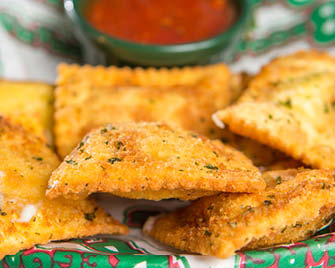 Order 4-Cheese Blend Breaded Ravioli food online from Beggars Pizza store, Blue Island on bringmethat.com