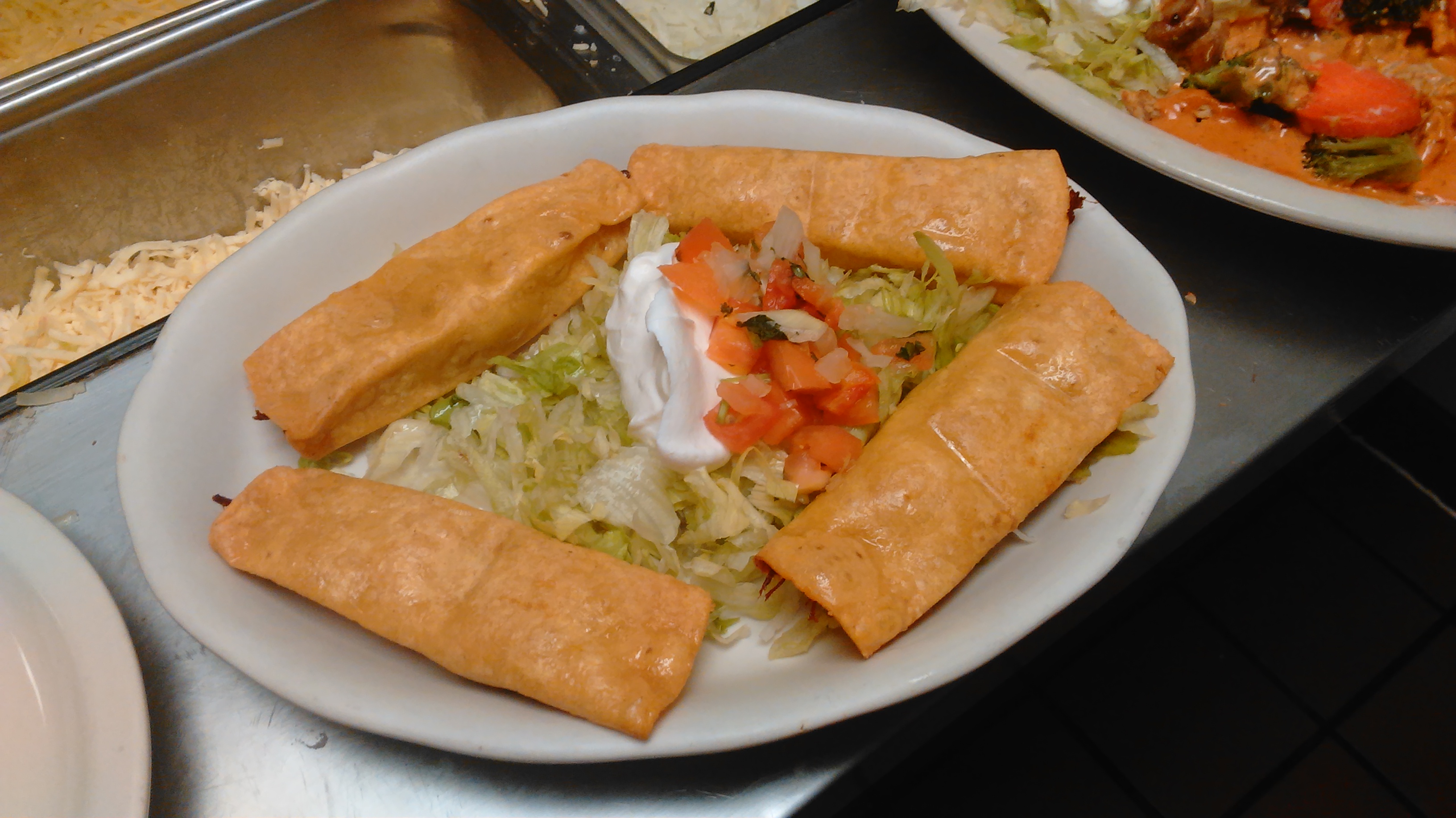 Order Mexican Tquitos food online from La Fiesta Charra store, Sioux City on bringmethat.com
