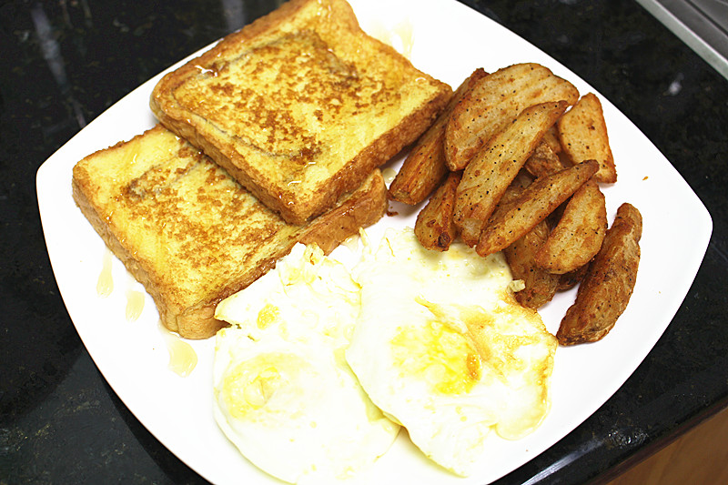 Order E. 2 Eggs, French Toast and Seasoned Fries food online from Sunshine Ice store, Weehawken on bringmethat.com