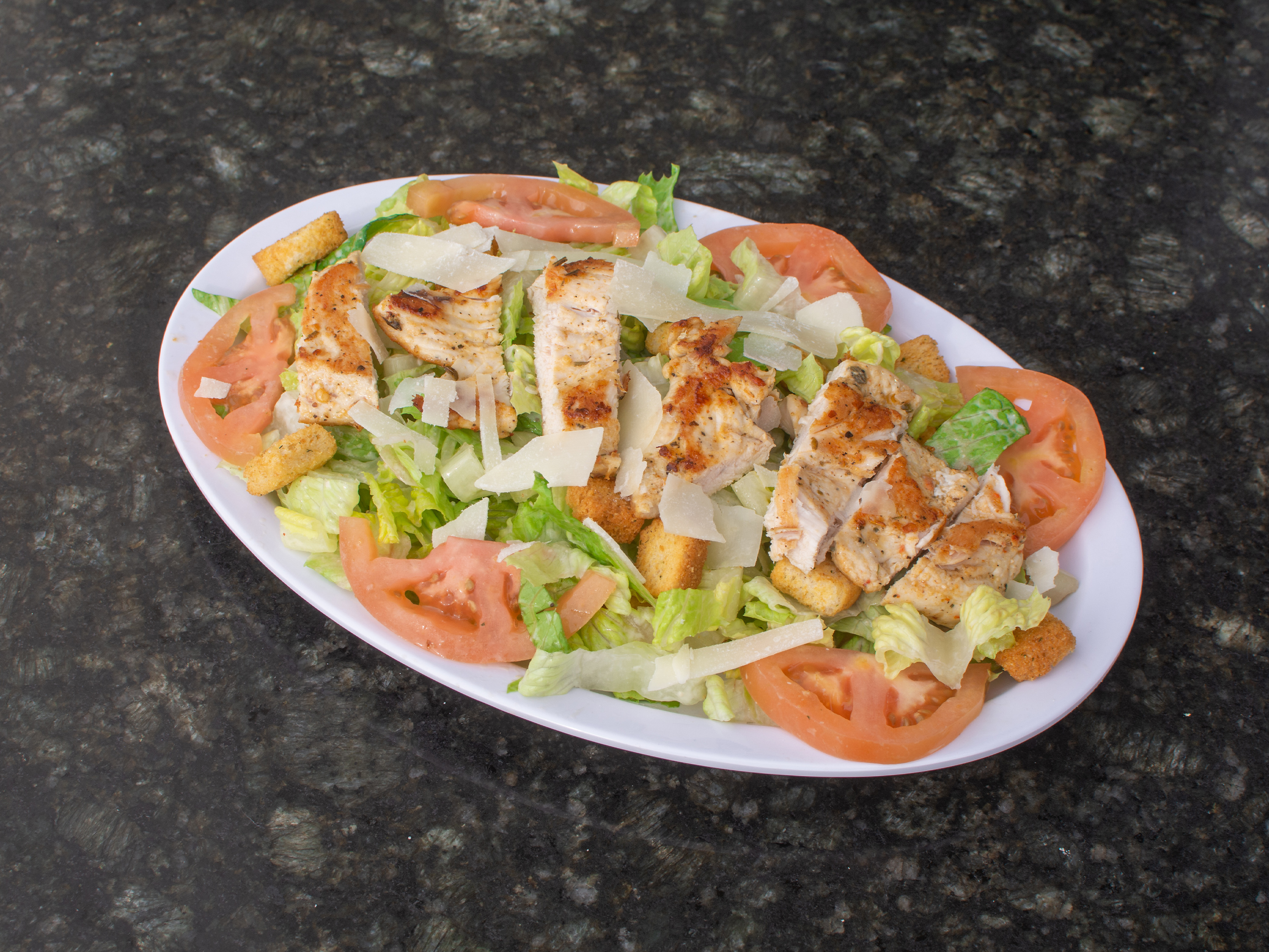 Order Caesar Salad food online from New York Pizza & Grill store, Dinuba on bringmethat.com