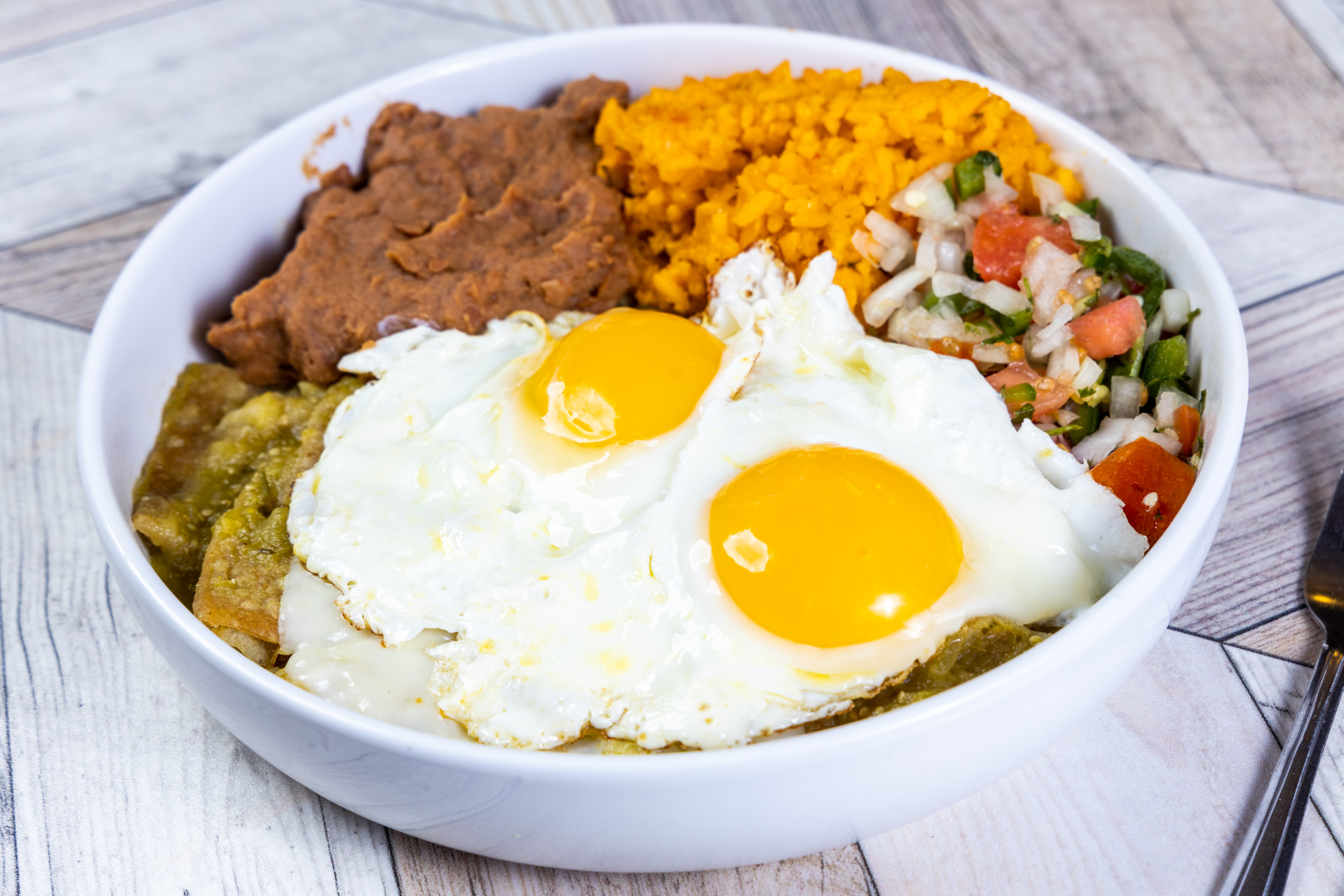 Order Huevos Chilaquiles food online from Top View Restaurant store, Chicago on bringmethat.com