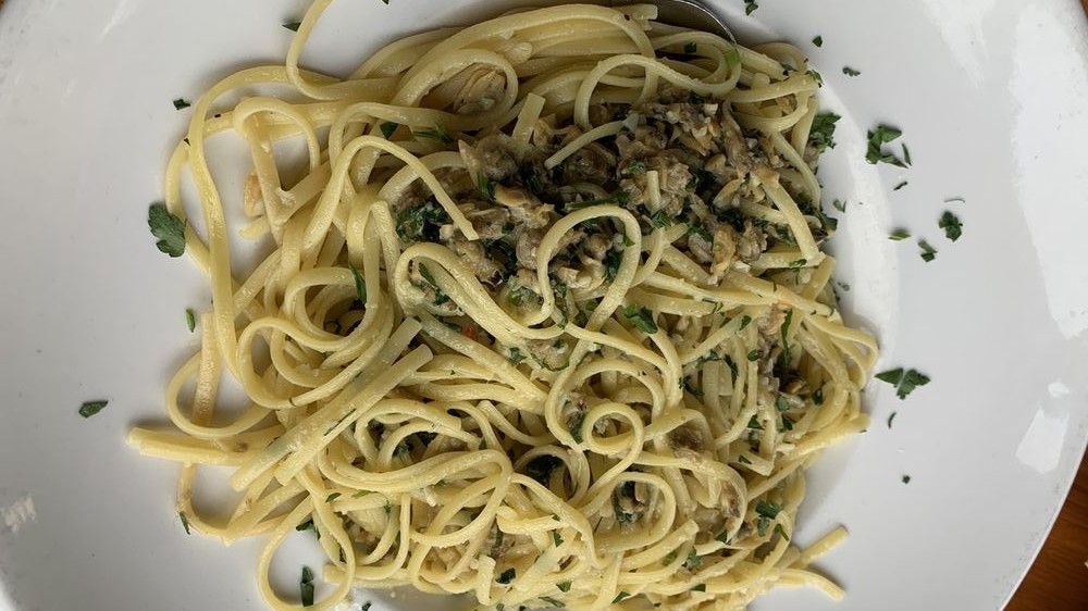 Order Garlic Pasta with Baby Clams food online from Hurricanes Bar & Grill store, Huntington Beach on bringmethat.com