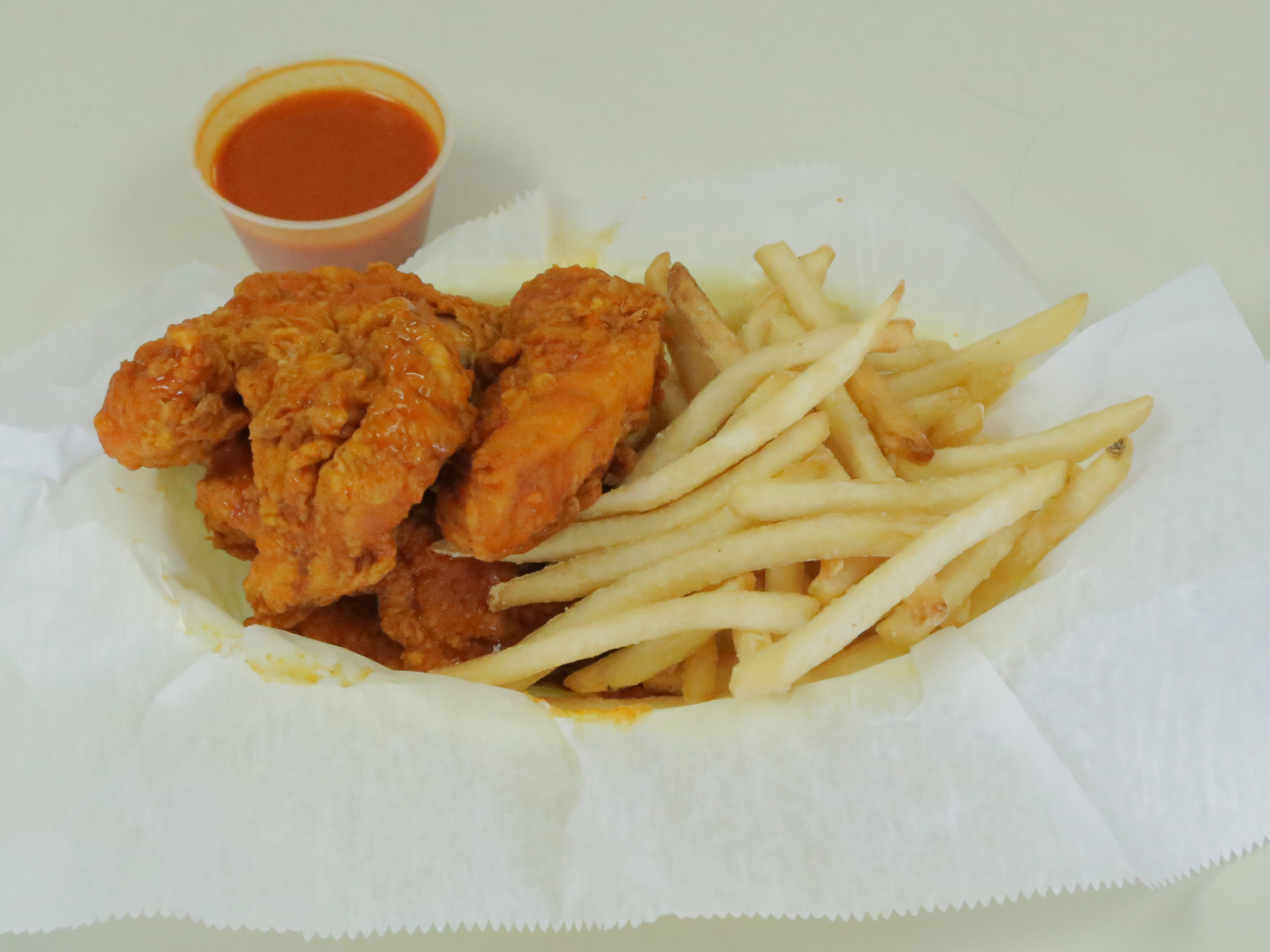 Order Buffalo Tenders food online from Tri-City Wings & Grill store, Newtonville on bringmethat.com