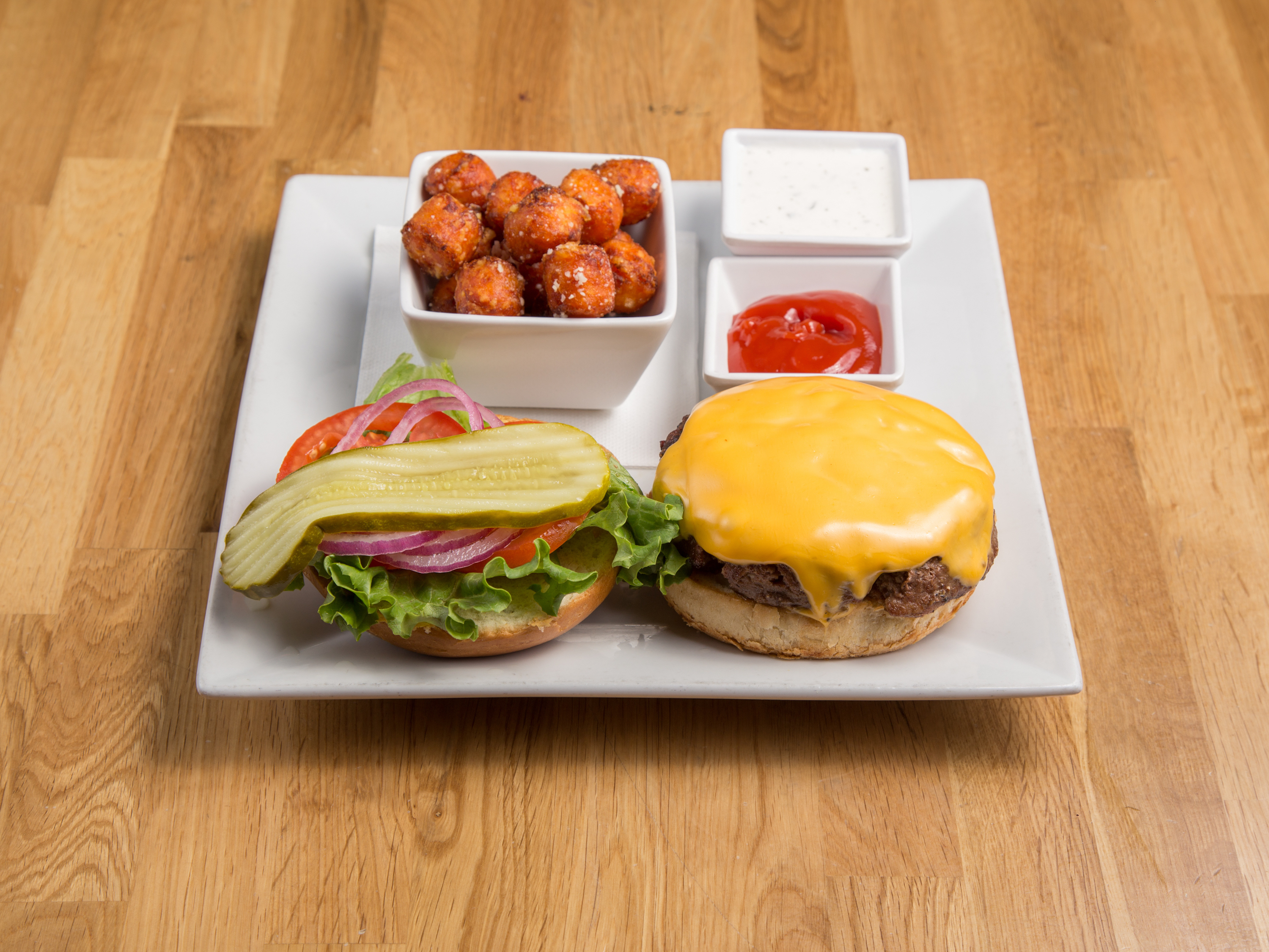 Order CHEESEBURGER food online from Philly Sports Grill store, Phoenix on bringmethat.com