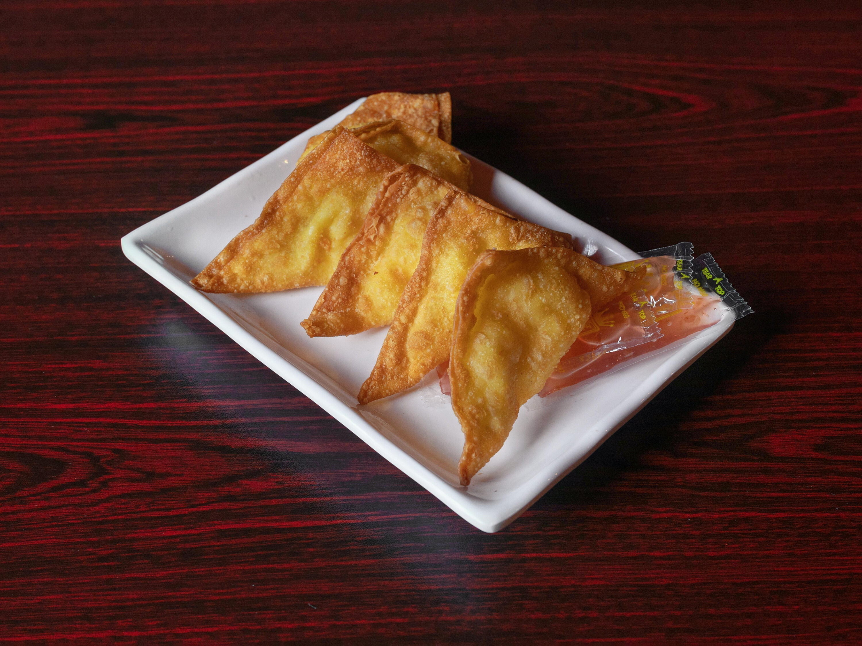 Order A4. Crab Rangoon food online from Asahi Japanese Grill store, Lenoir City on bringmethat.com