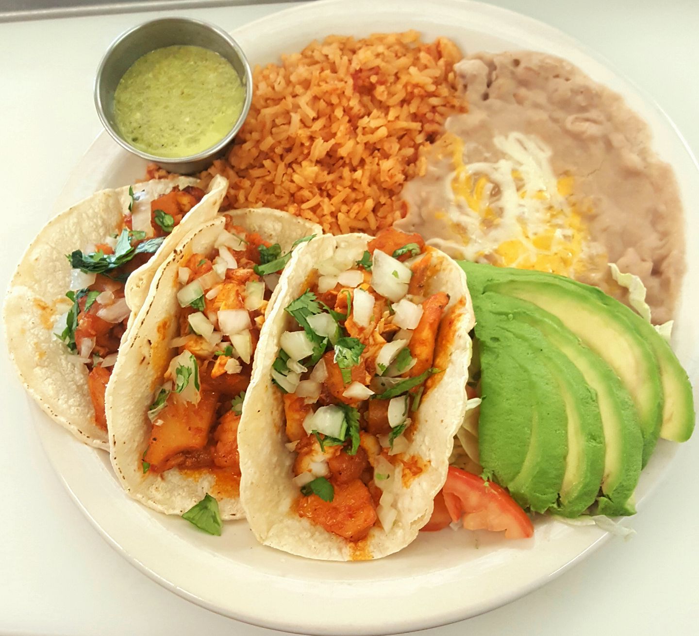 Order Al Pastor Tacos with Rice and Beans food online from El Jacalito store, Las Cruces on bringmethat.com