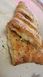 Order Pesto Supreme Calzone food online from Papa Ray's Pizza - Miriam St. store, Daly City on bringmethat.com