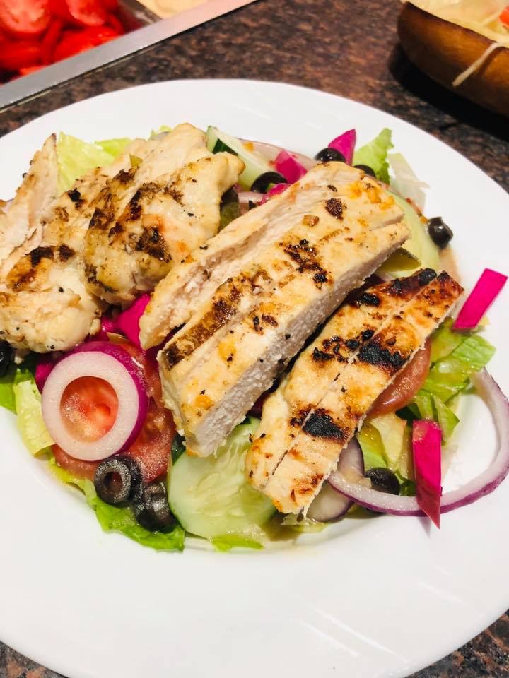 Order Grilled Chicken Caesar Salad food online from Aladdin Crown Pizza store, New Haven on bringmethat.com